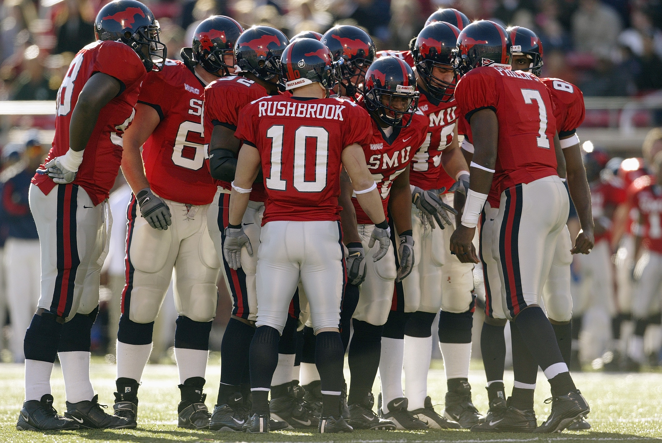 DALLAS - NOVEMBER 29:  The Southern Methodist University Mustangs talk in the huddle during the game against the Texas Christian University Horned Frogs on November 29, 2003 at Gerald J. Ford Stadium in Dallas, Texas. TCU won 20-13.  (Photo by Brian Bahr/