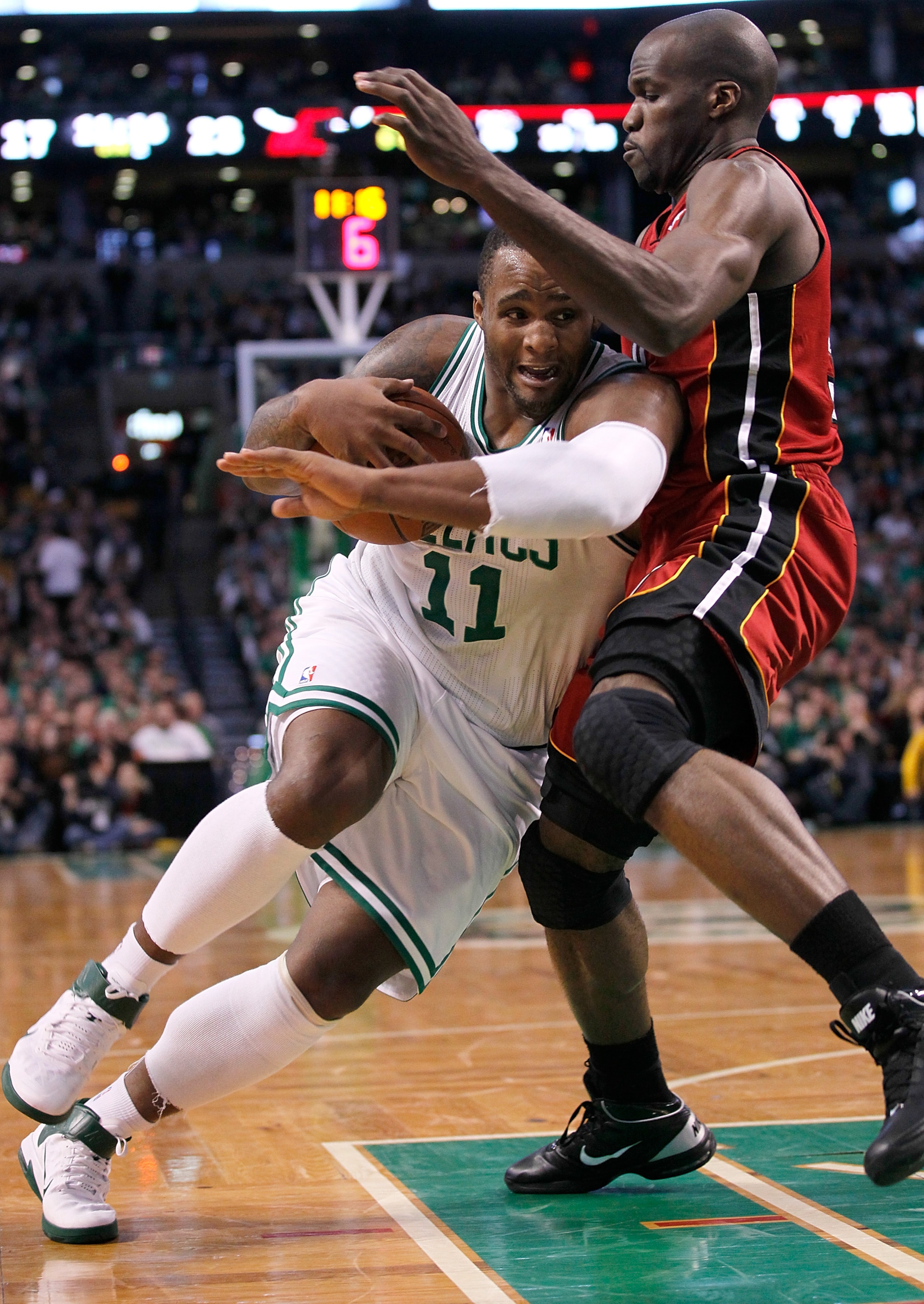 BOSTON - FEBRUARY 13: Glen Davis #11 of the Boston Celtics drives against Joel Anthony #50 of the Miami Heat at TD Garden on February 13, 2011 in Boston, Massachusetts. The Celtics won 85-82. NOTE TO USER: User expressly acknowledges and agrees that, by BOSTON - FEBRUARY 13: Glen Davis #11 of the Boston Celtics drives against Joel Anthony #50 of the Miami Heat at TD Garden on February 13, 2011 in Boston, Massachusetts. The Celtics won 85-82. NOTE TO USER: User expressly acknowledges and agrees that, by