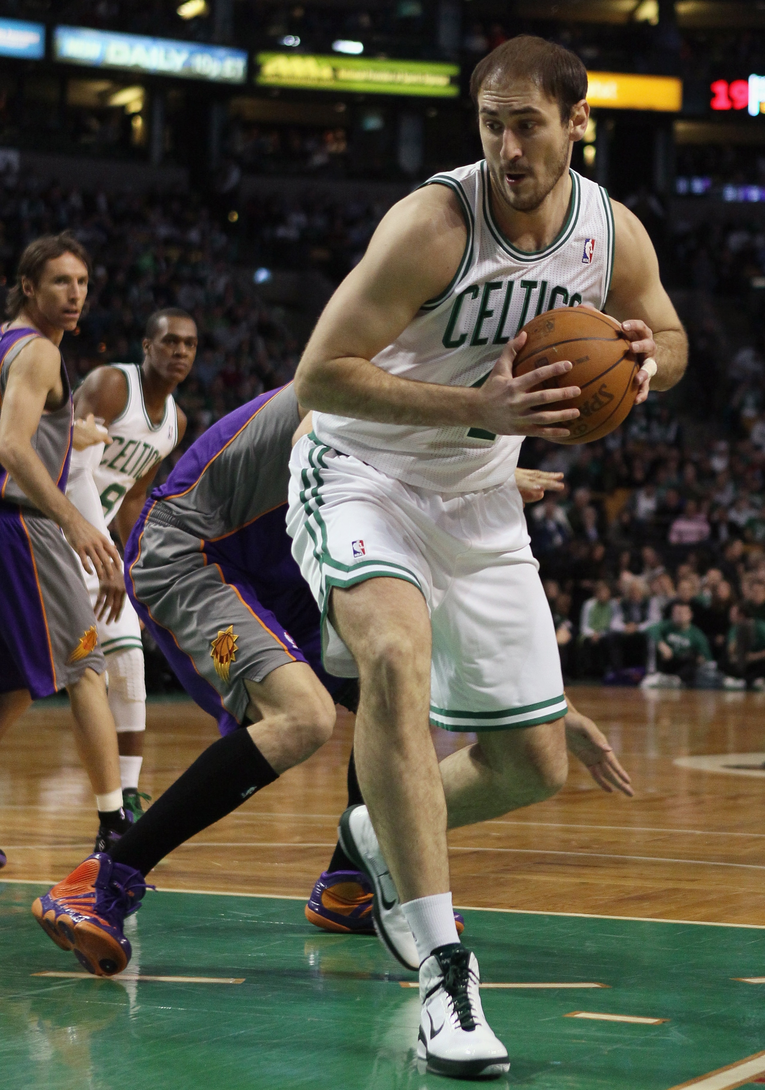 BOSTON, MA - MARCH 02: Nenad Krstic #4 of the Boston Celtics heads for the net as Robin Lopez #15 of the Phoenix Suns defends on March 2, 2011 at the TD Garden in Boston, Massachusetts. NOTE TO USER: User expressly acknowledges and agrees that, by downlo BOSTON, MA - MARCH 02: Nenad Krstic #4 of the Boston Celtics heads for the net as Robin Lopez #15 of the Phoenix Suns defends on March 2, 2011 at the TD Garden in Boston, Massachusetts. NOTE TO USER: User expressly acknowledges and agrees that, by downlo