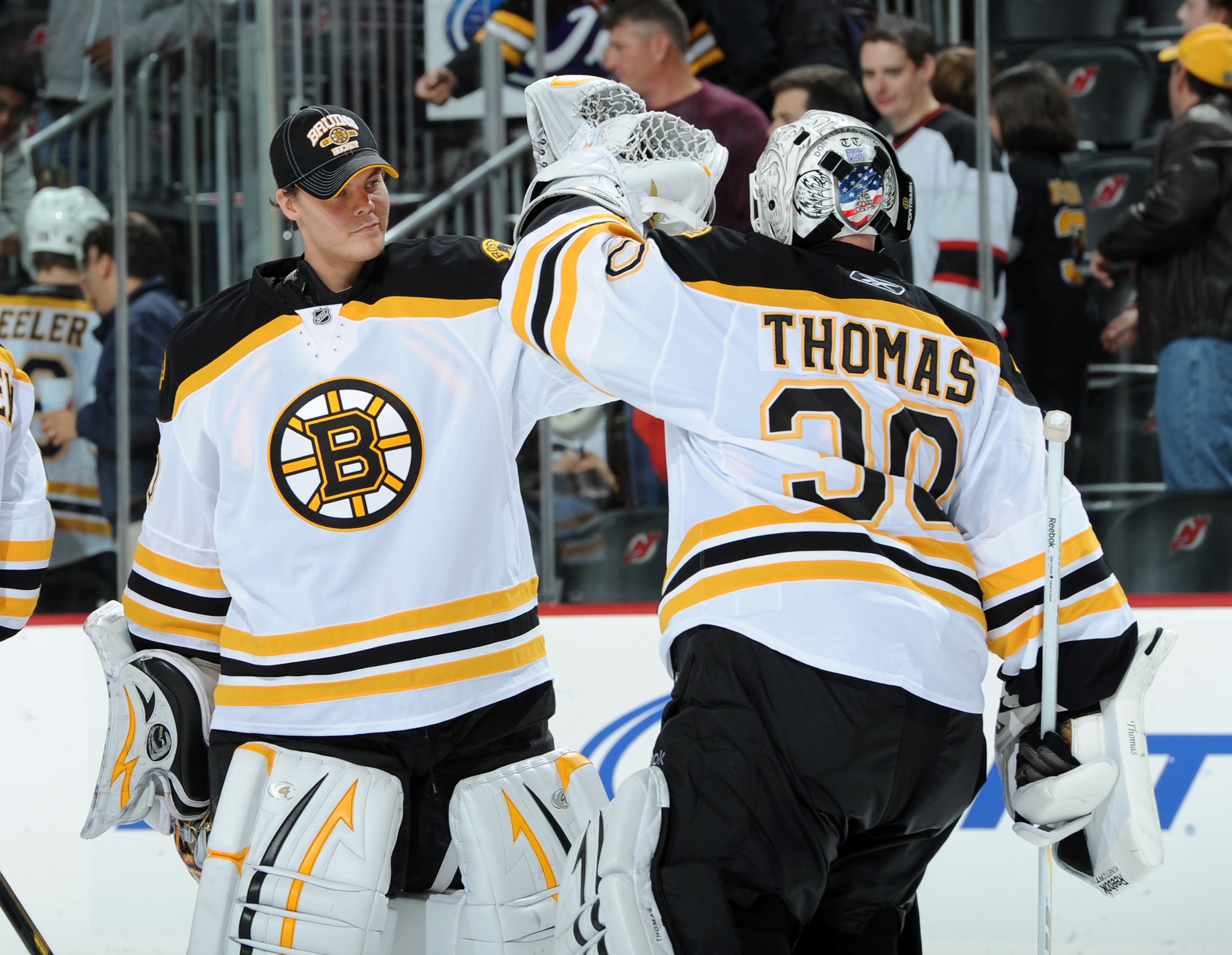 NEWARK, NJ - OCTOBER 16: Tim Thomas #30 of the Boston Bruins is congratulated by Tuukka Rask #40 of the Boston Bruins after the Boston Bruins defeated the New Jersey Devils 4-1 at the Prudential Center on October 16, 2010 in Newark, New Jersey. (Photo by NEWARK, NJ - OCTOBER 16: Tim Thomas #30 of the Boston Bruins is congratulated by Tuukka Rask #40 of the Boston Bruins after the Boston Bruins defeated the New Jersey Devils 4-1 at the Prudential Center on October 16, 2010 in Newark, New Jersey. (Photo by