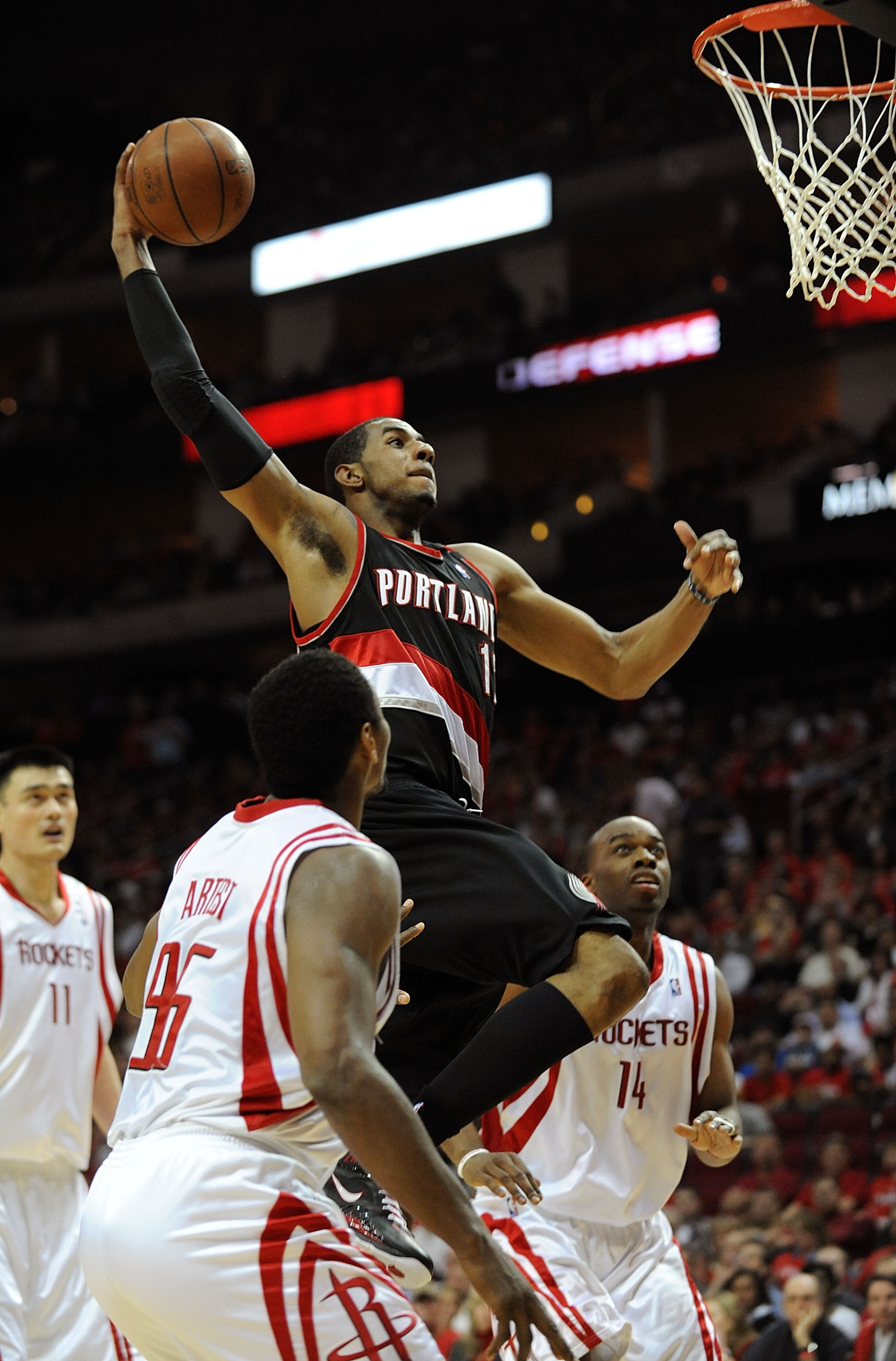 HOUSTON - APRIL 24:  Forward LaMarcus Aldridge #12 of the Portland Trail Blazers makes the slam dunk against Ron Artest #96 of the Houston Rockets in Game Three of the Western Conference Quarterfinals during the 2009 NBA Playoffs at Toyota Center on April