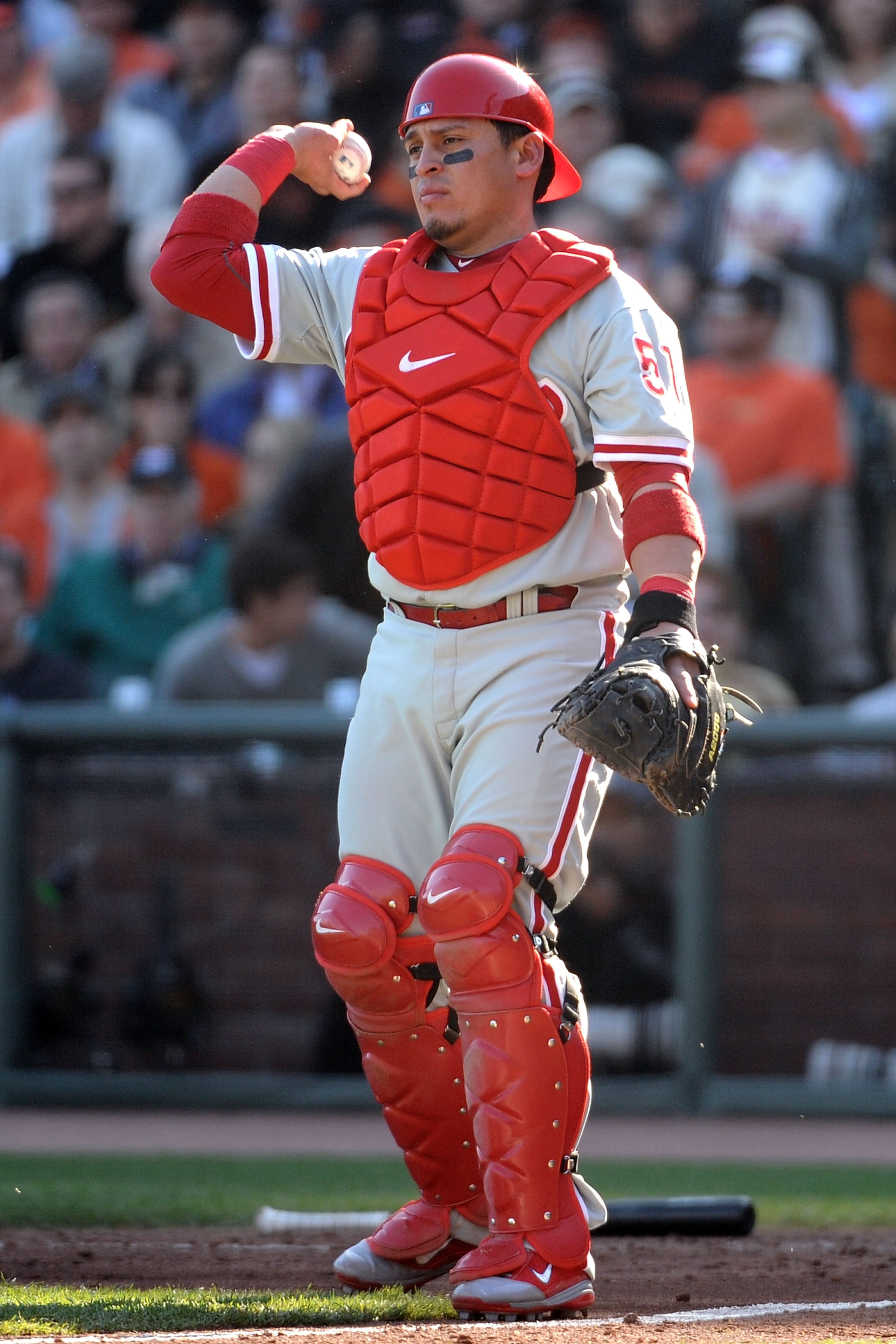 SAN FRANCISCO - OCTOBER 19:  Carlos Ruiz #51 of the Philadelphia Phillies throws the ball back to the pitcher against the San Francisco Giants in Game Three of the NLCS during the 2010 MLB Playoffs at AT&T Park on October 19, 2010 in San Francisco, Califo