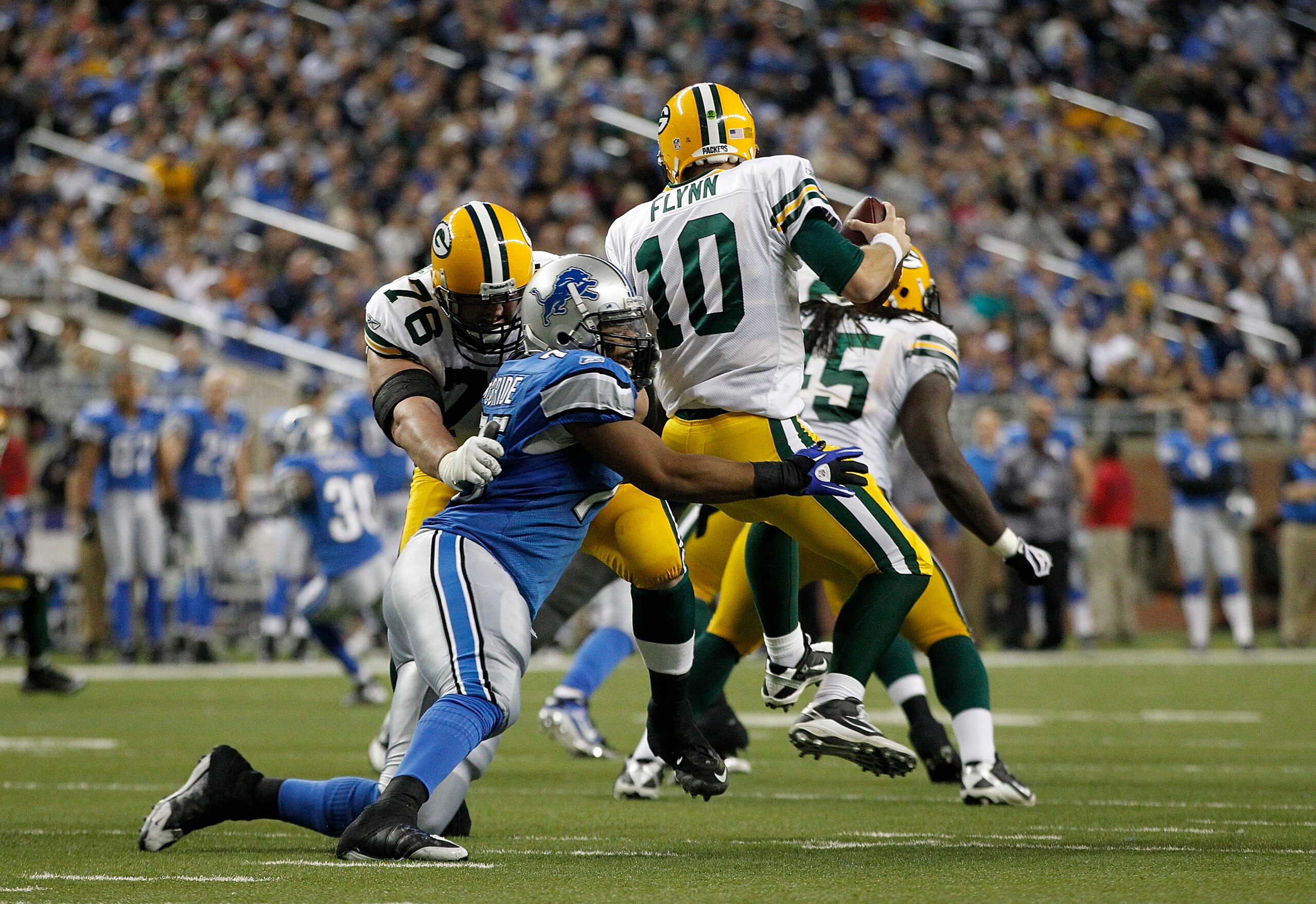 DETROIT - DECEMBER 12: Matt Flynn #10 of the Green Bay Packers is sacked by Turk McBride #75 of the Detroit Lions during the fourth quarter of the game against the Detroit Lions at Ford Field on December 12, 2010 in Detroit, Michigan. The Lions defeated DETROIT - DECEMBER 12: Matt Flynn #10 of the Green Bay Packers is sacked by Turk McBride #75 of the Detroit Lions during the fourth quarter of the game against the Detroit Lions at Ford Field on December 12, 2010 in Detroit, Michigan. The Lions defeated