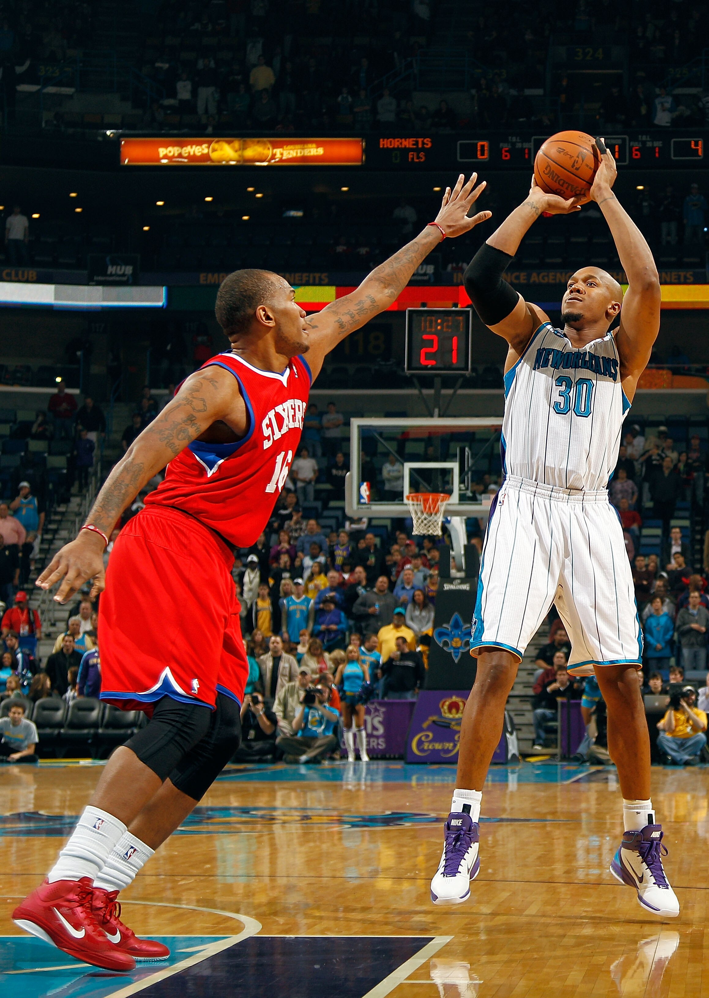 NEW ORLEANS, LA - JANUARY 03: David West #30 of the New Orleans Hornets shoots the ball over Marreese Speights #16 of the Philadelphia 76ers in the first half at New Orleans Arena on January 3, 2011 in New Orleans, Louisiana. NOTE TO USER: User expressl NEW ORLEANS, LA - JANUARY 03: David West #30 of the New Orleans Hornets shoots the ball over Marreese Speights #16 of the Philadelphia 76ers in the first half at New Orleans Arena on January 3, 2011 in New Orleans, Louisiana. NOTE TO USER: User expressl