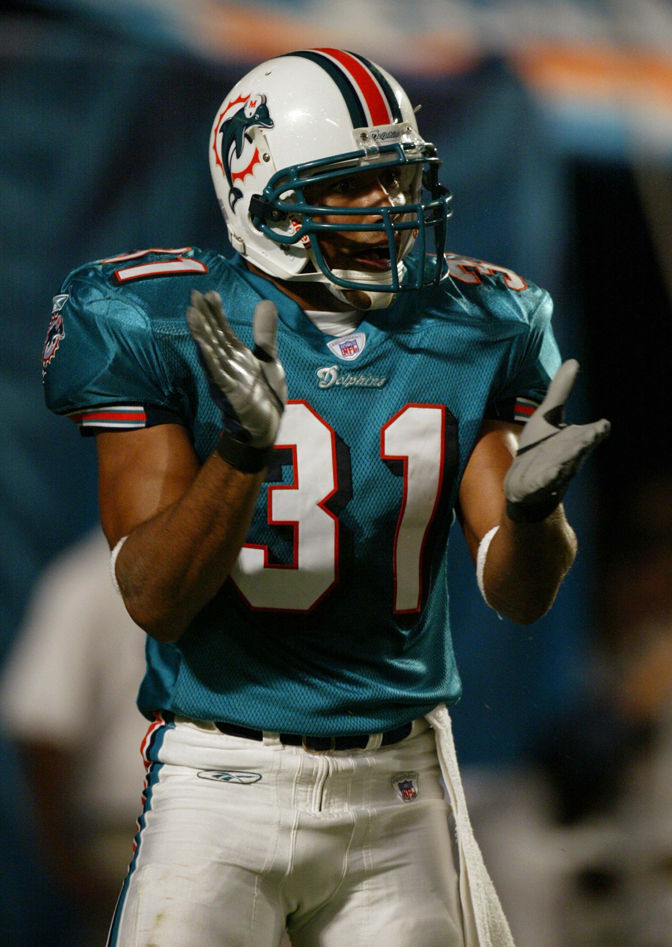MIAMI - SEPTEMBER 21:  Safety Brock Marion #31 of the Miami Dolphins celebrates after intercepting a pass during a game against the Buffalo Bills on September 21, 2003 at Pro Player Stadium in Miami, Florida. The Dolphins defeated the Bills 17-7. (Photo b