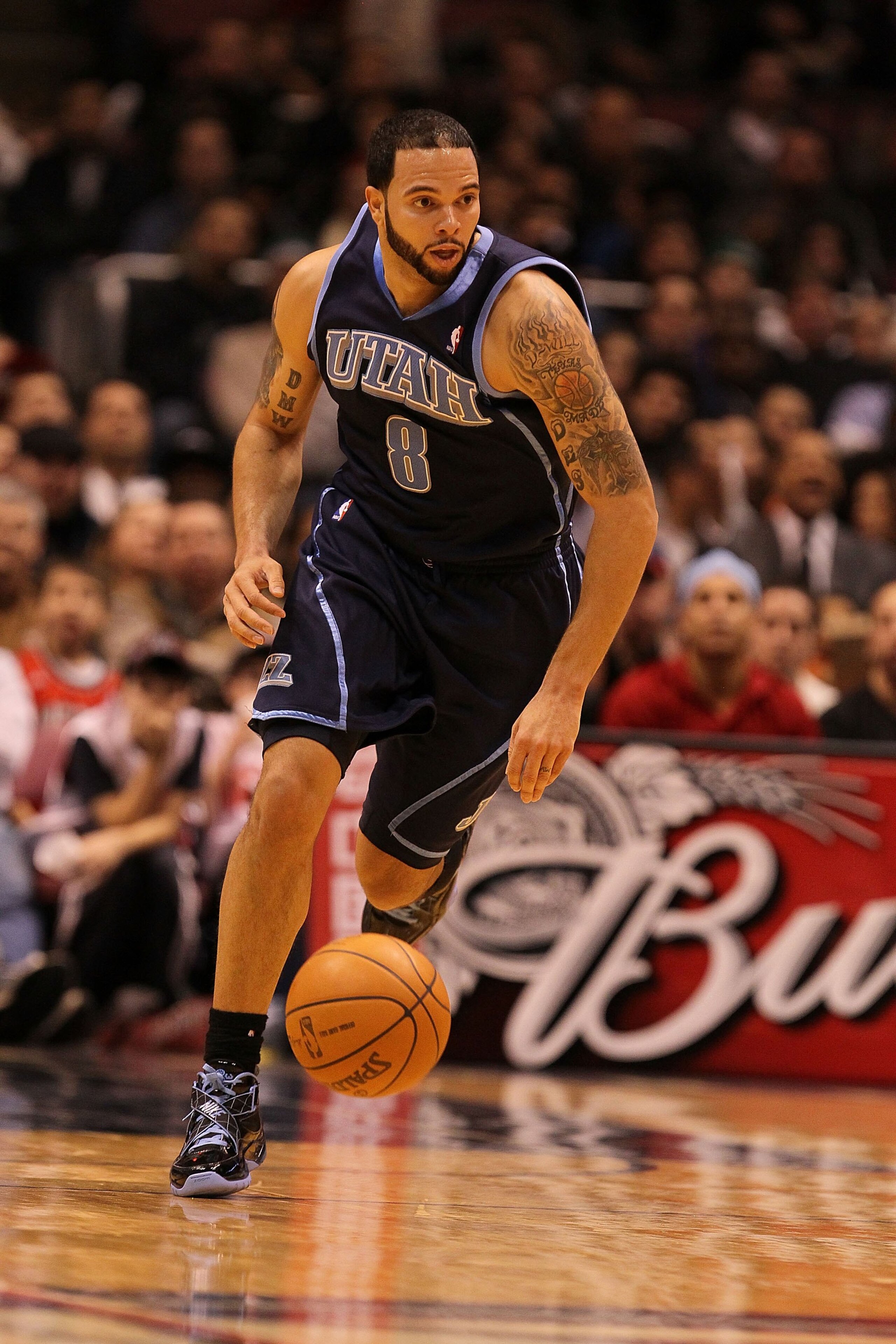 EAST RUTHERFORD, NJ - DECEMBER 16:  Deron Williams #8 of The Utah Jazz dunks against the New Jersey Nets during their game on December 16th, 2009 at The Izod Center in East Rutherford, New Jersey.  NOTE TO USER: User expressly acknowledges and agrees that