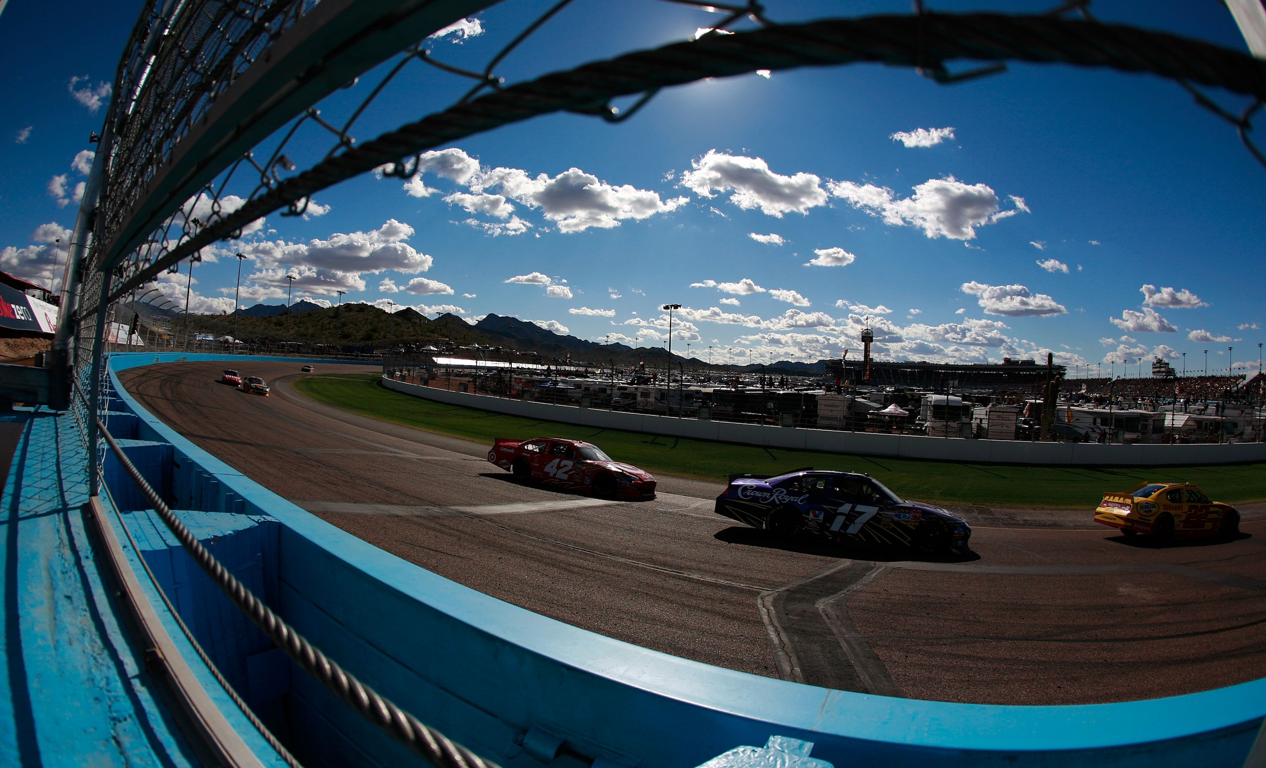 AVONDALE, AZ - FEBRUARY 27:  Kurt Busch, driver of the #22 Shell/Pennzoil Dodge, leads Matt Kenseth, driver of the #17 Crown Royal Ford, and Juan Pablo Montoya, driver of the #42 Target Chevrolet, during the NASCAR Sprint Cup Series Subway Fresh Fit 500 a