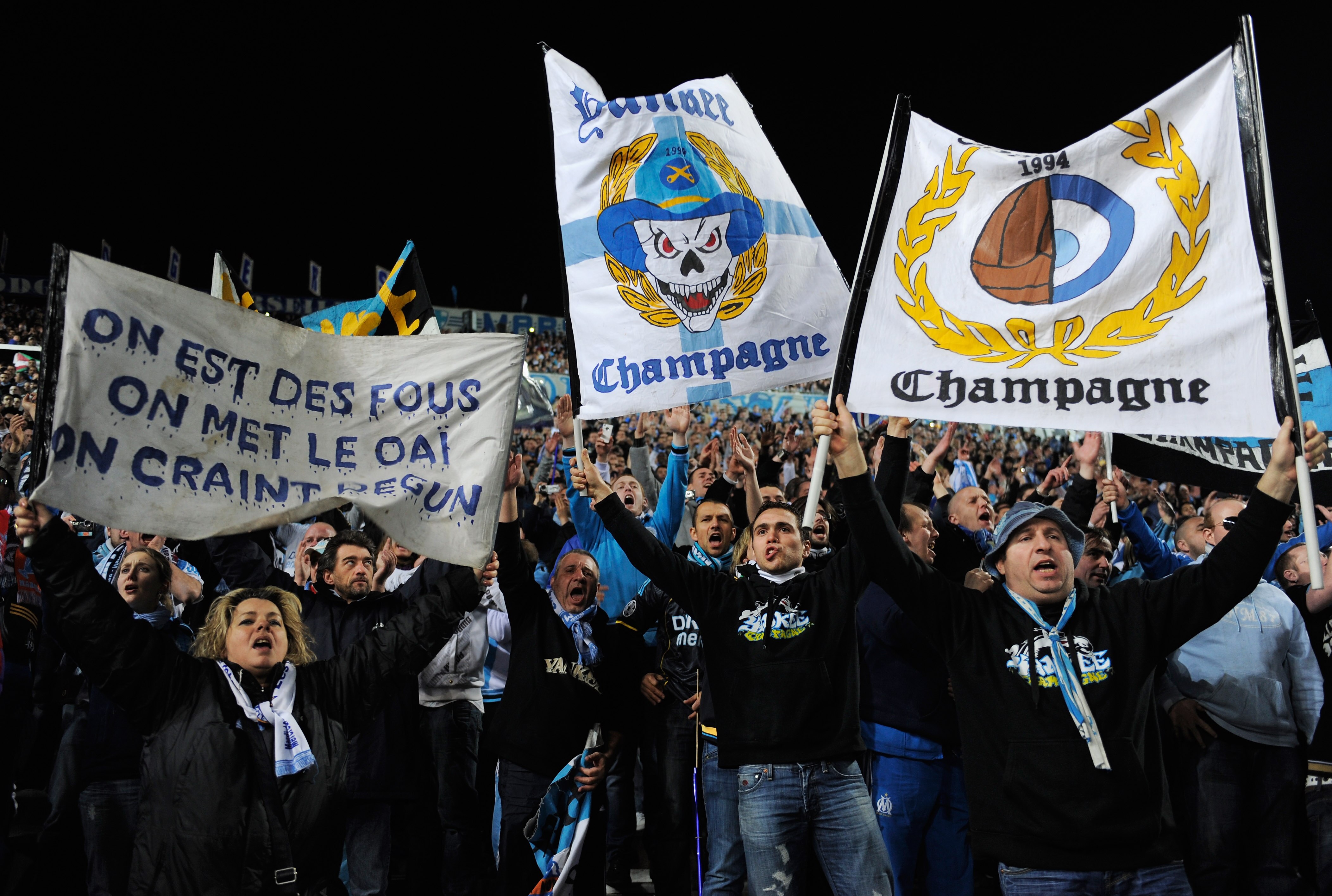 MARSEILLE, FRANCE - FEBRUARY 23: Marseille fans hold banners during the UEFA Champions League round of 16 first leg match between Marseille and Manchester United at the Stade Velodrome on February 23, 2011 in Marseille, France.  (Photo by Michael Regan/Ge