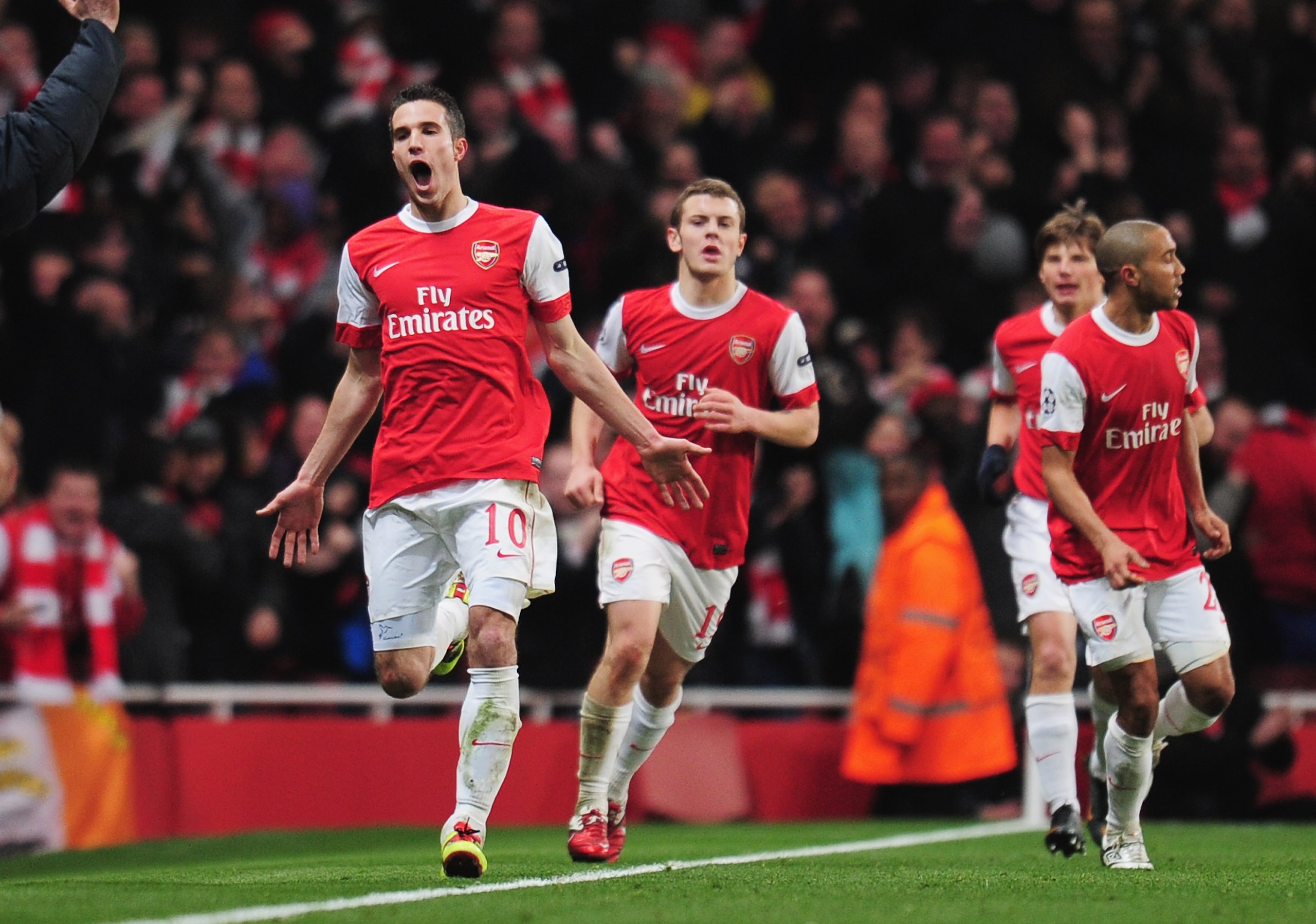 LONDON, ENGLAND - FEBRUARY 16:  Robin van Persie of Arsenal celebrates Arsenal's first goal during the UEFA Champions League round of 16 first leg match between Arsenal and Barcelona at the Emirates Stadium on February 16, 2011 in London, England.  (Photo