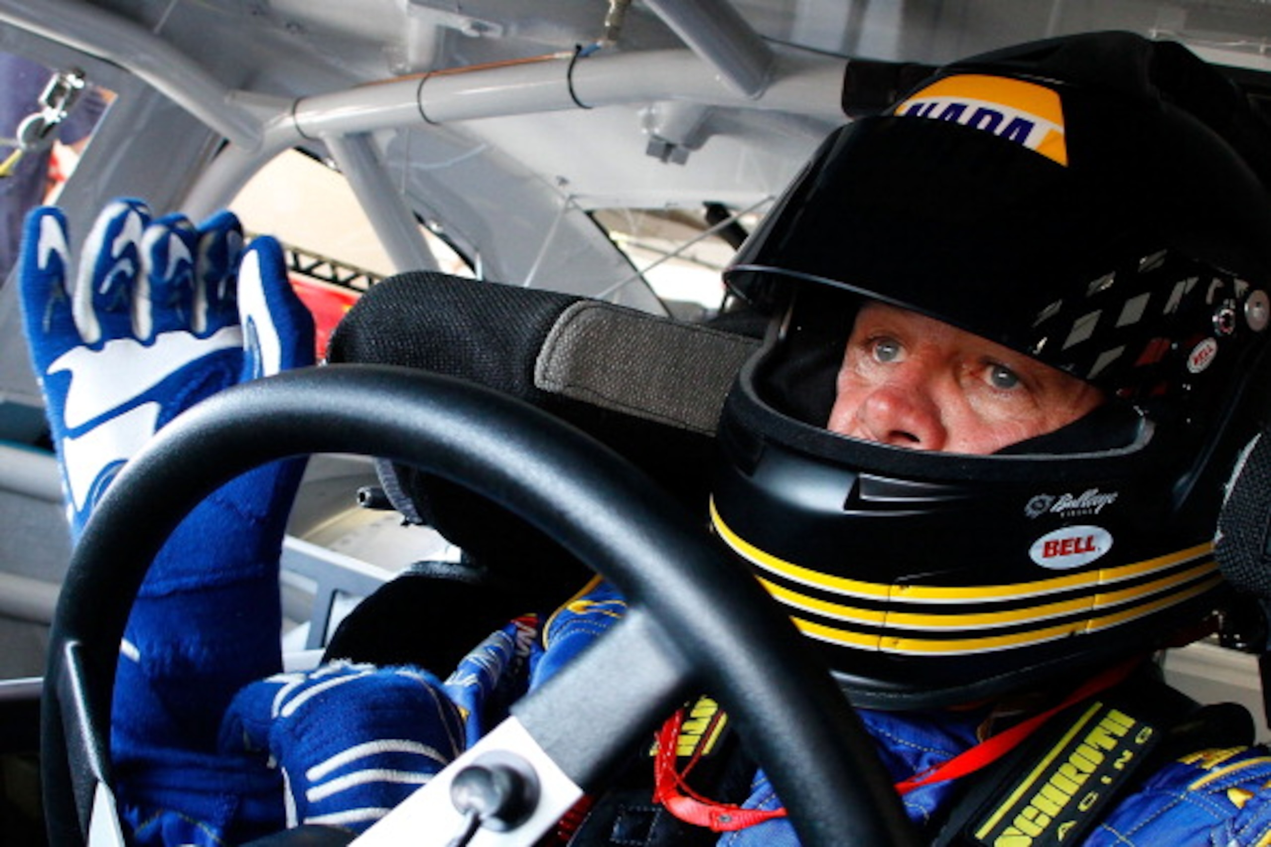 DAYTONA BEACH, FL - FEBRUARY 19:  Michael Waltrip, driver of the #15 NAPA Auto Parts Toyota, sits in his car in the garage area during practice for the NASCAR Sprint Cup Series Daytona 500 at Daytona International Speedway on February 19, 2011 in Daytona