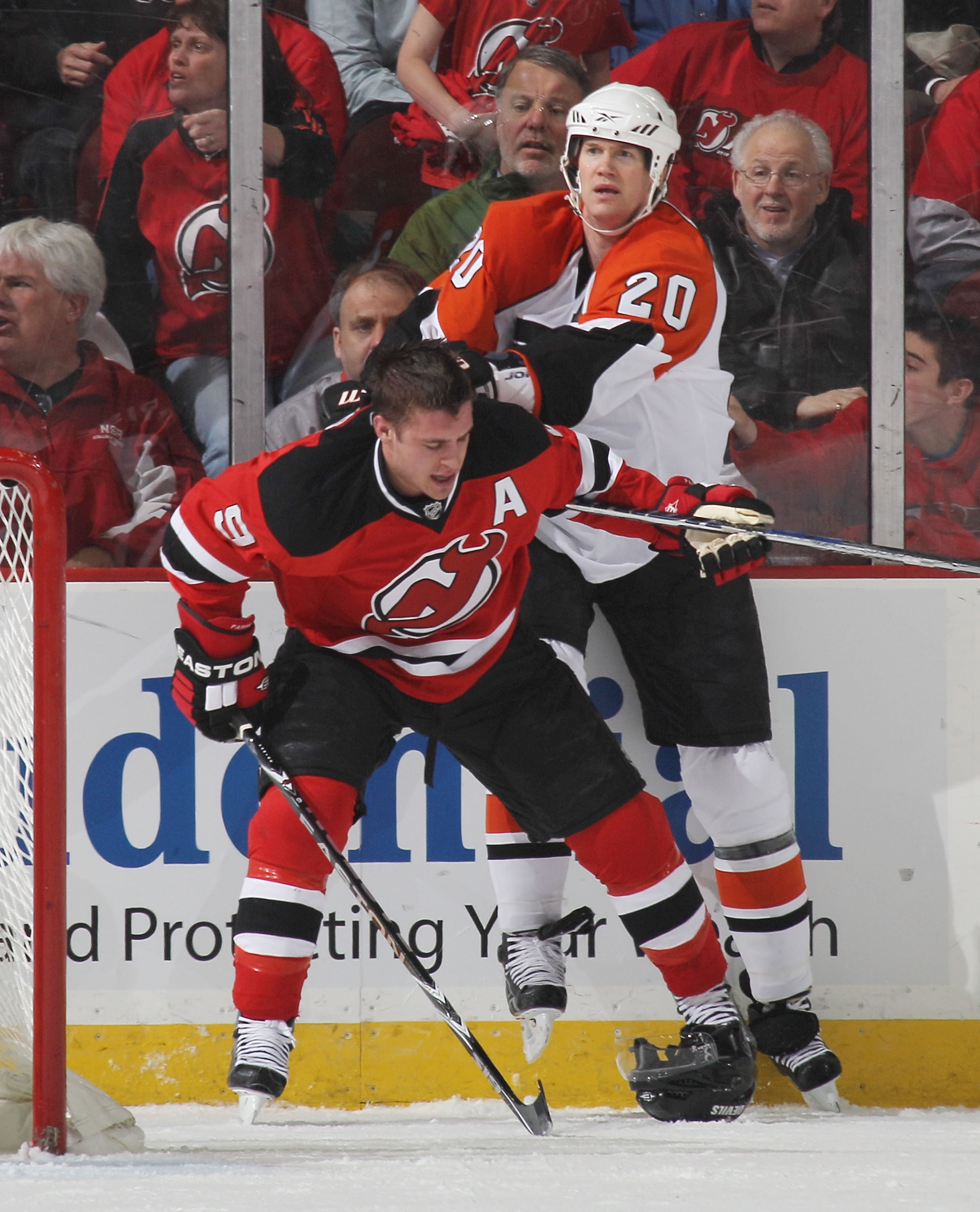 NEWARK, NJ - APRIL 14: Chris Pronger #20 of the Philadelphia Flyers hits Zach Parise #9 of the New Jersey Devils in Game One of the Eastern Conference Quarterfinals during the 2010 NHL Stanley Cup Playoffs at the Prudential Center on April 14, 2010 in New NEWARK, NJ - APRIL 14: Chris Pronger #20 of the Philadelphia Flyers hits Zach Parise #9 of the New Jersey Devils in Game One of the Eastern Conference Quarterfinals during the 2010 NHL Stanley Cup Playoffs at the Prudential Center on April 14, 2010 in New