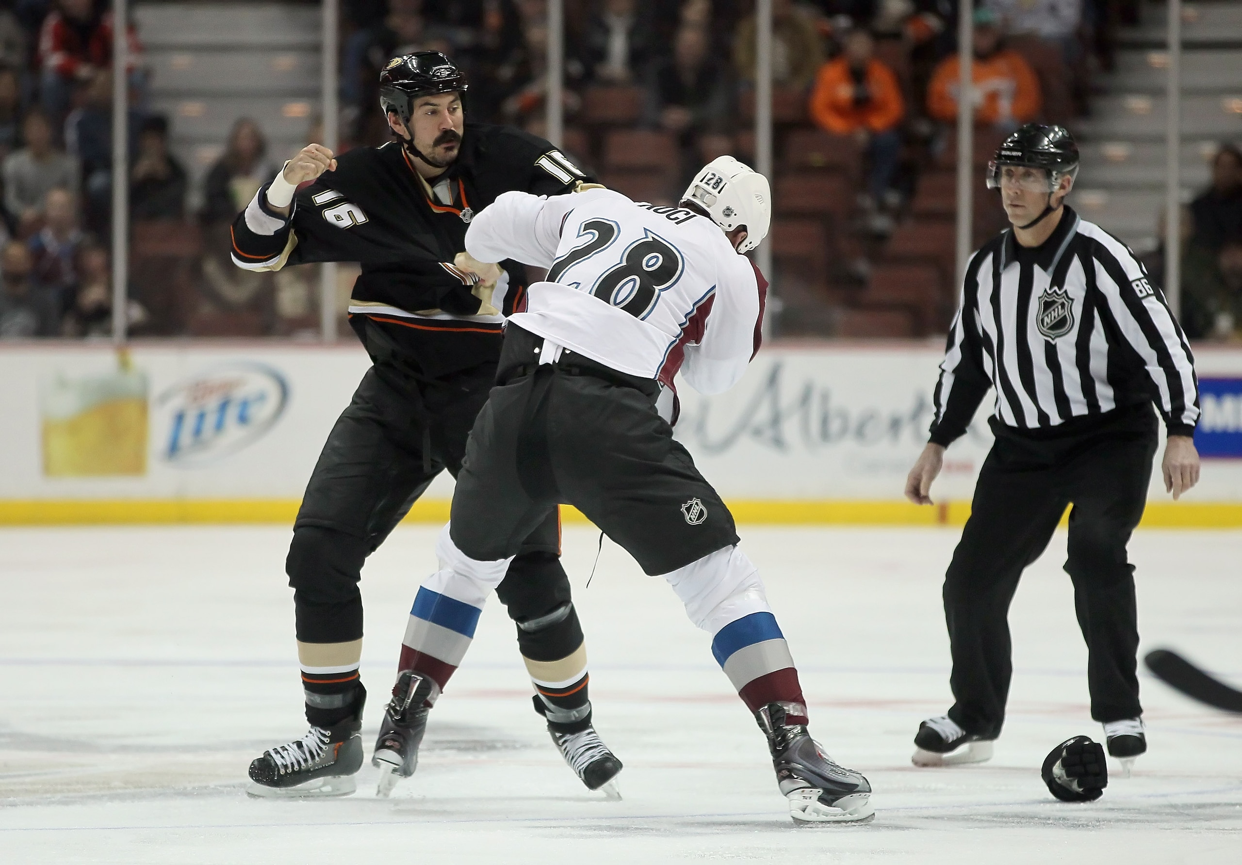 ANAHEIM, CA - FEBRUARY 27:  George Parros #16 of the Anaheim Ducks fights David Koci #28 of the Colorado Avalanche at Honda Center on February 27, 2011 in Anaheim, California.  (Photo by Jeff Gross/Getty Images)