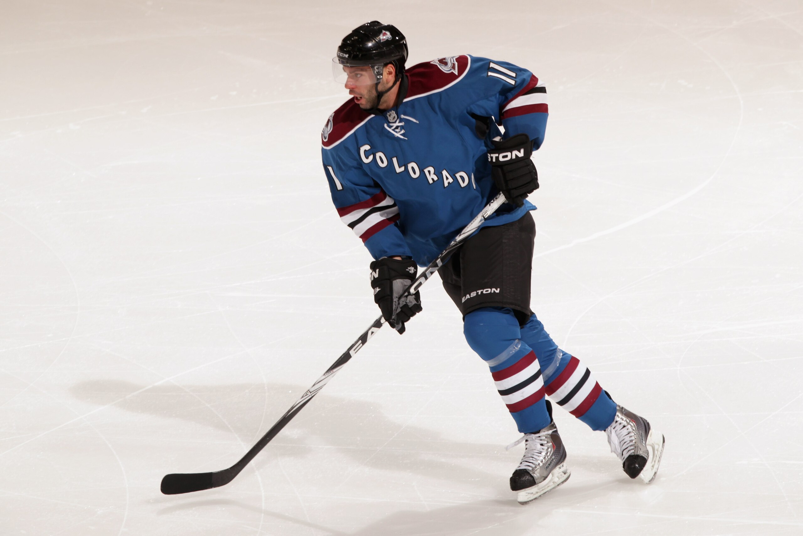 DENVER, CO - FEBRUARY 16:  Philippe Dupuis #11 of the Colorado Avalanche skates against the Pittsburgh Penguins at the Pepsi Center on February 16, 2011 in Denver, Colorado. The Penguins defeated the Avalanche 3-2 in overtime.  (Photo by Doug Pensinger/Ge