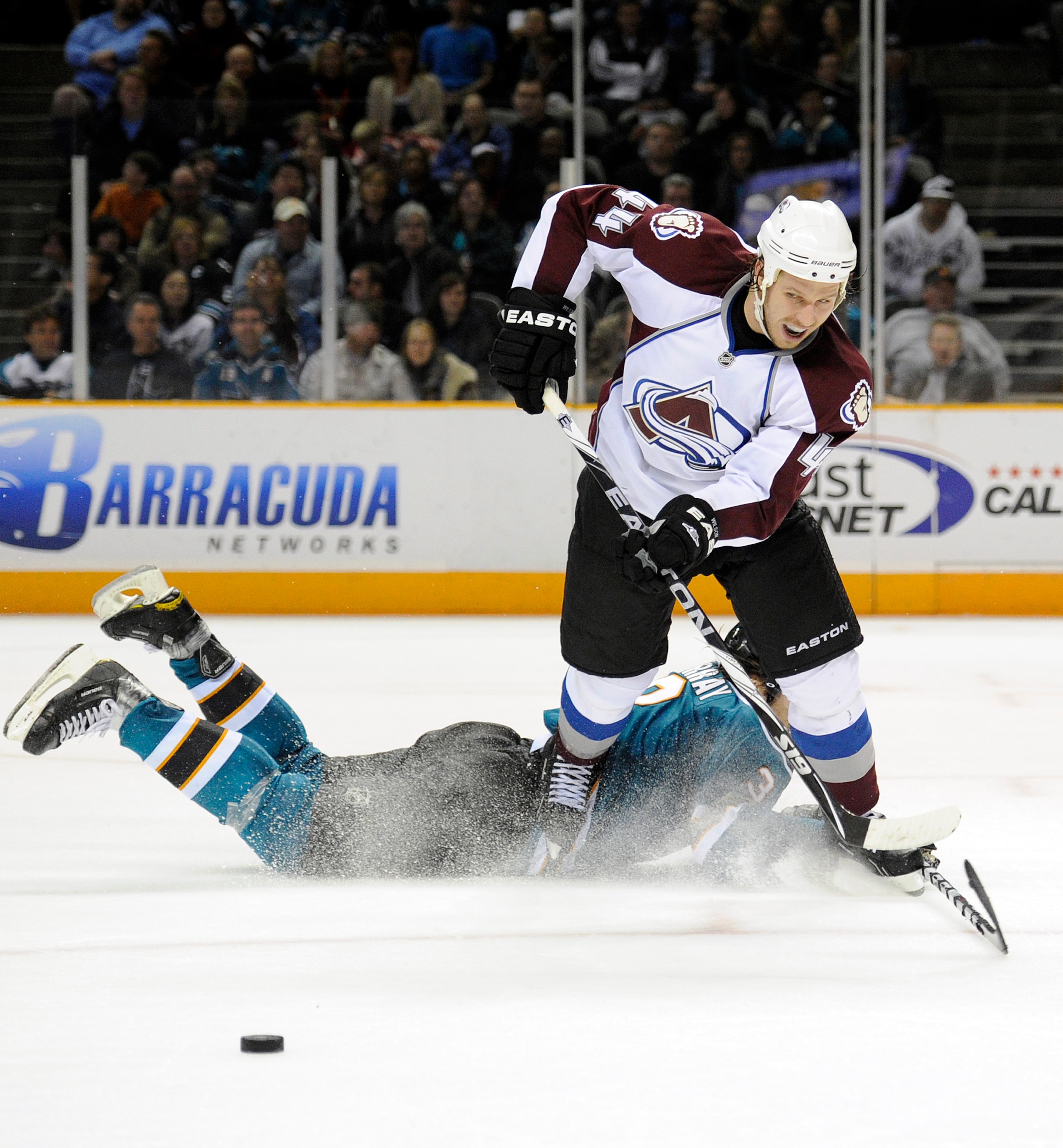 SAN JOSE, CA - MARCH 1: Douglas Murray #3 of the San Jose Sharks makes a diving save on the shot of Ryan Wilson #44 of the Colorado Avalanche in overtime during an NHL hockey game at the HP Pavilion on March 1, 2011 in San Jose, California. The Sharks won