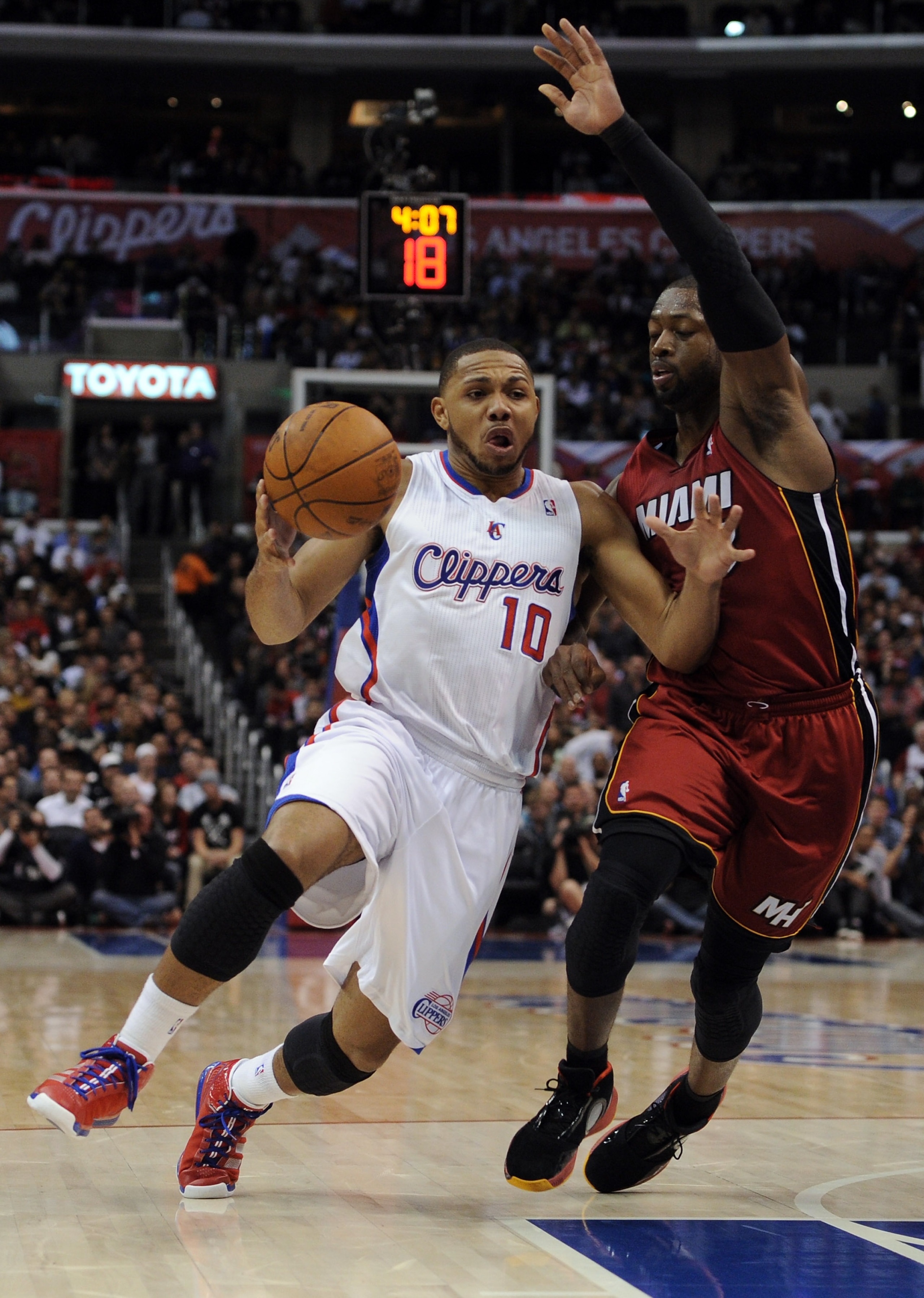 LOS ANGELES, CA - JANUARY 12: Eric Gordon #10 of the Los Angeles Clippers heads to the basket as he is guarded by Dwyane Wade #3 of the Miami Heat at Staples Center on January 12, 2011 in Los Angeles, California. NOTE TO USER: User expressly acknowledge LOS ANGELES, CA - JANUARY 12: Eric Gordon #10 of the Los Angeles Clippers heads to the basket as he is guarded by Dwyane Wade #3 of the Miami Heat at Staples Center on January 12, 2011 in Los Angeles, California. NOTE TO USER: User expressly acknowledge