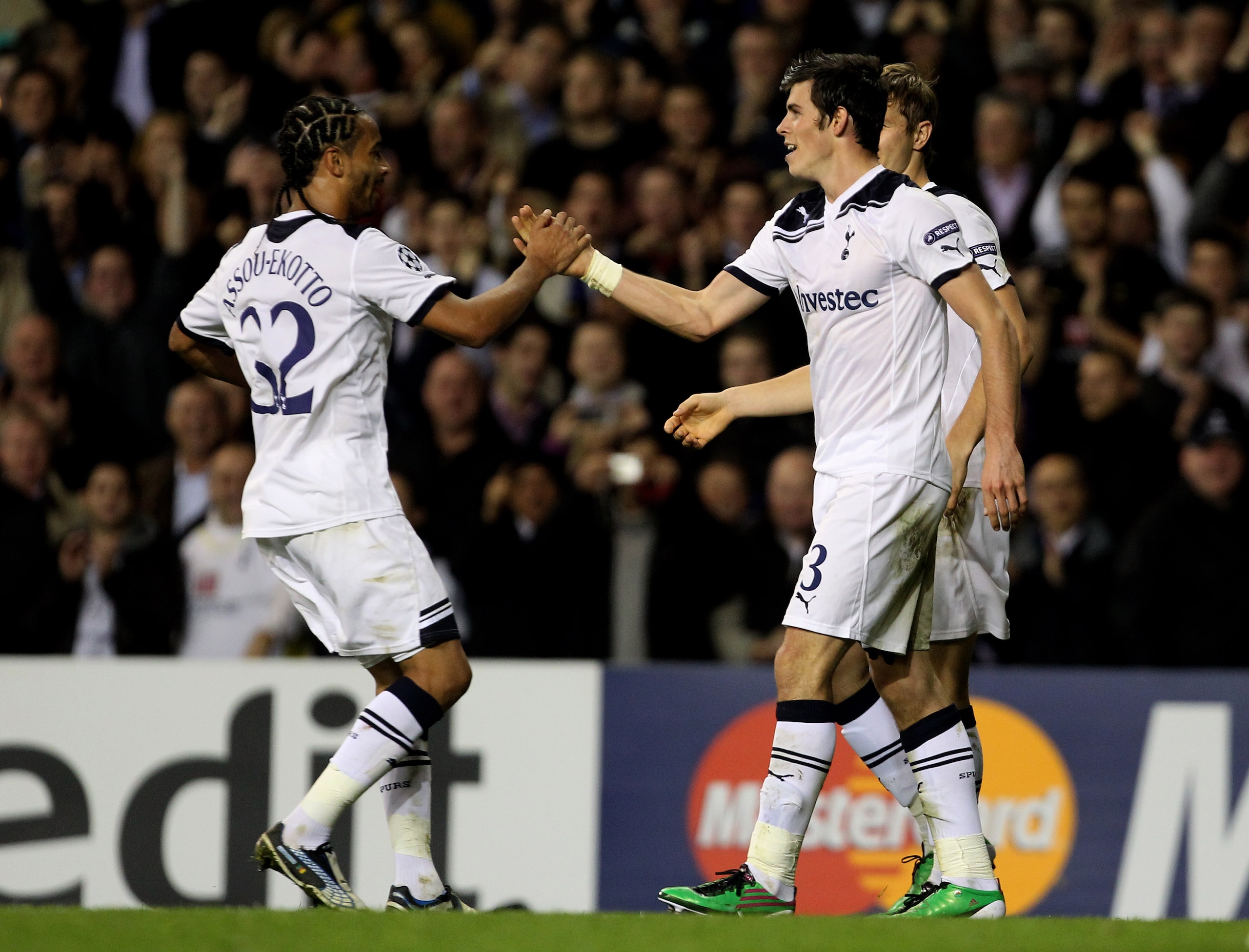 LONDON, ENGLAND - NOVEMBER 02:  Gareth Bale (R)  of Spurs is congratulated by teammate Benoit Assou-Ekotto (L) after setting up hius team's third goal during the UEFA Champions League Group A match between Tottenham Hotspur and Inter Milan at White Hart L