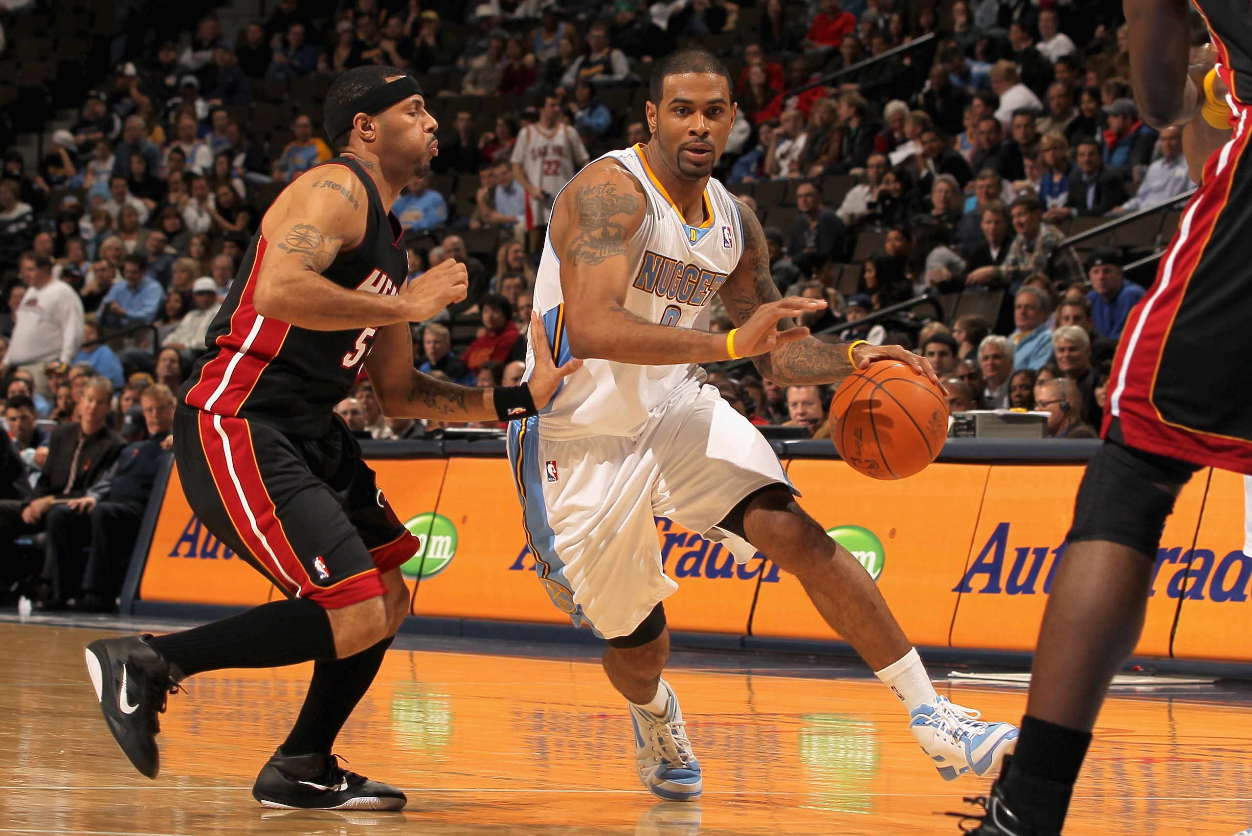 DENVER, CO - JANUARY 13: Gary Forbes #0 of the Denver Nuggets dribbles the ball upcourt against Eddie House #55 of the Miami Heat at the Pepsi Center on January 13, 2011 in Denver, Colorado. The Nuggets defeated the Heat 130-102. NOTE TO USER: User expre DENVER, CO - JANUARY 13: Gary Forbes #0 of the Denver Nuggets dribbles the ball upcourt against Eddie House #55 of the Miami Heat at the Pepsi Center on January 13, 2011 in Denver, Colorado. The Nuggets defeated the Heat 130-102. NOTE TO USER: User expre