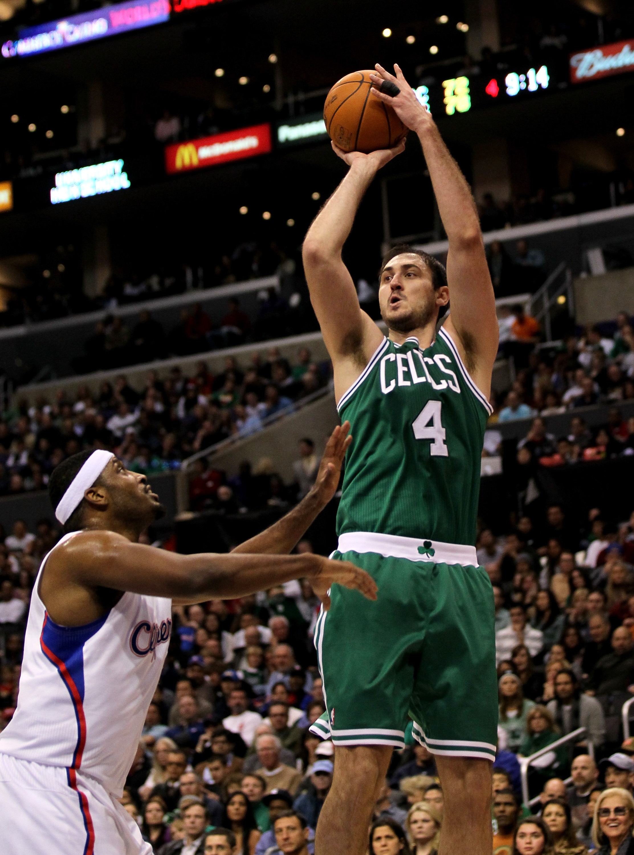 LOS ANGELES, CA - FEBRUARY 26:  Nenad Krstic #4 of the Boston Celtics shoots over Craig Smith #1 of the Los Angeles Clippers at Staples Center on February 26, 2011  in Los Angeles, California.  The Celtics won 99-92.   NOTE TO USER: User expressly acknowl