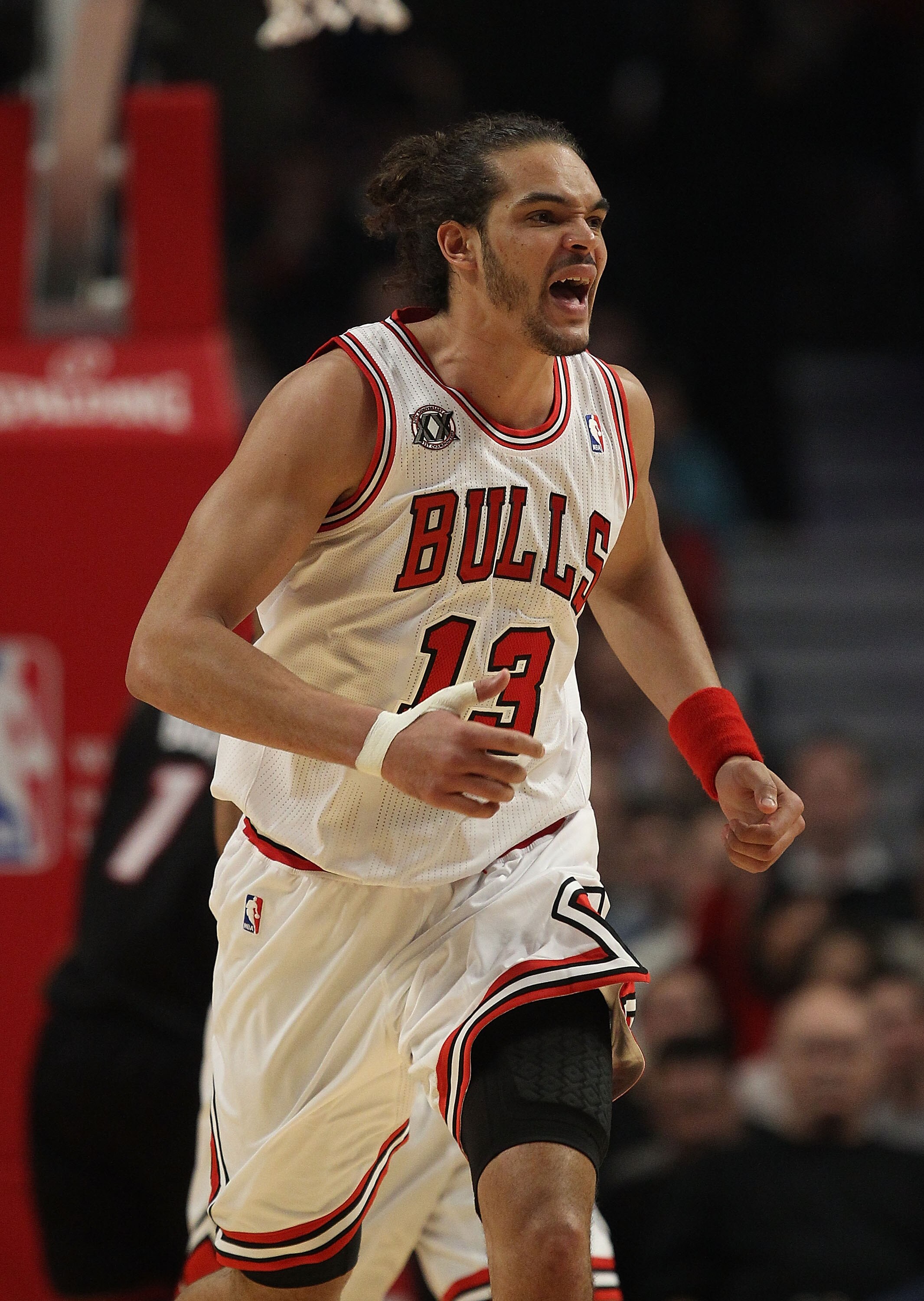CHICAGO, IL - FEBRUARY 24: Joakim Noah #13 of the Chicago Bulls celebrates a dunk against the Miami Heat at the United Center on February 24, 2011 in Chicago, Illinois. The Bulls defeated the Heat 93-89. NOTE TO USER: User expressly acknowledges and agree