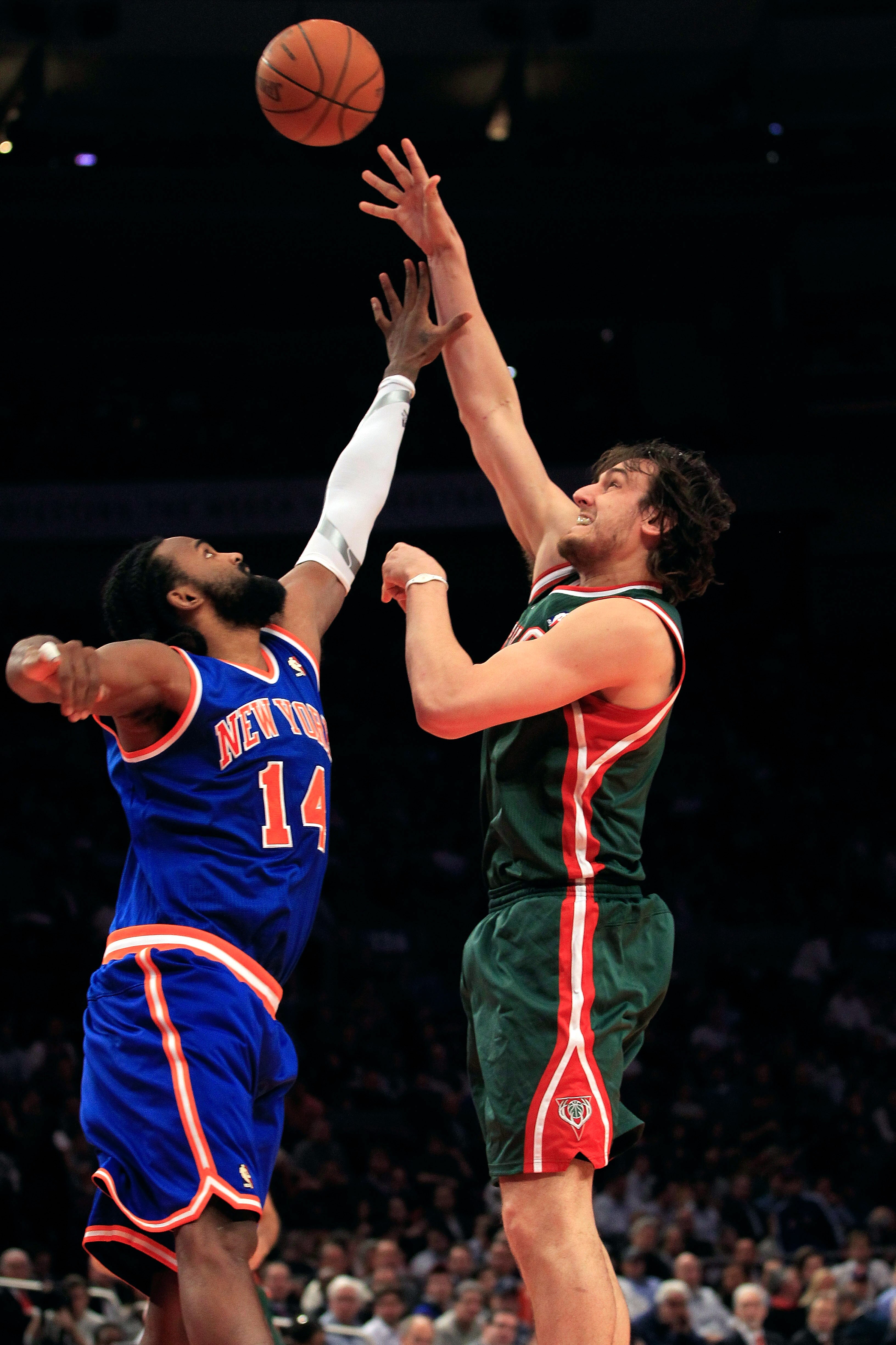 NEW YORK, NY - FEBRUARY 23:  Andrew Bogut #6 of the Milwaukee Bucks shoots the ball over Ronny Turiaf #14 of the New York Knicks at Madison Square Garden on February 23, 2011 in New York City. NOTE TO USER: User expressly acknowledges and agrees that, by