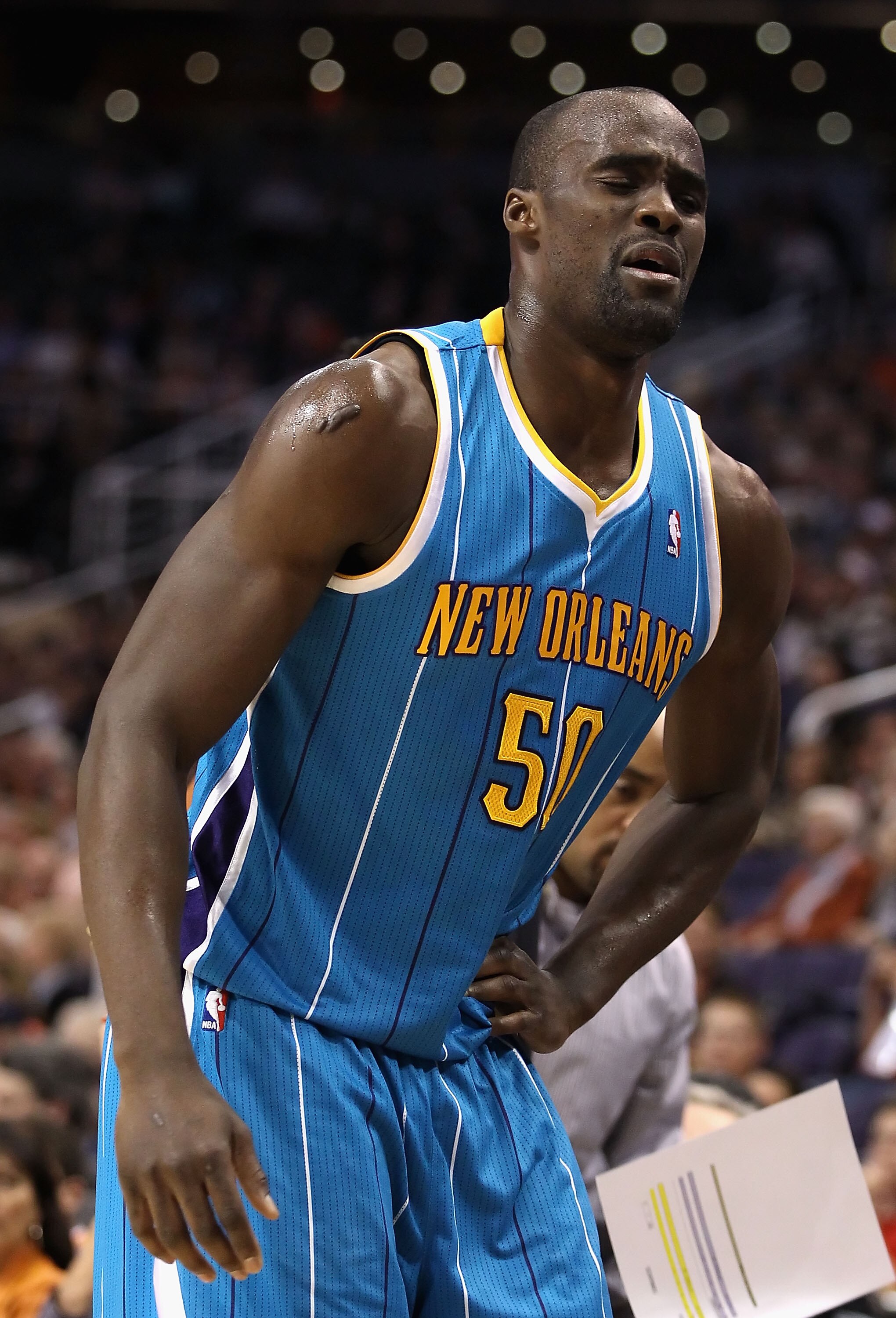 PHOENIX, AZ - JANUARY 30:  Emeka Okafor #50 of the New Orleans Hornets reacts after an injury to his hip during the NBA game against the Phoenix Suns at US Airways Center on January 30, 2011 in Phoenix, Arizona.  NOTE TO USER: User expressly acknowledges