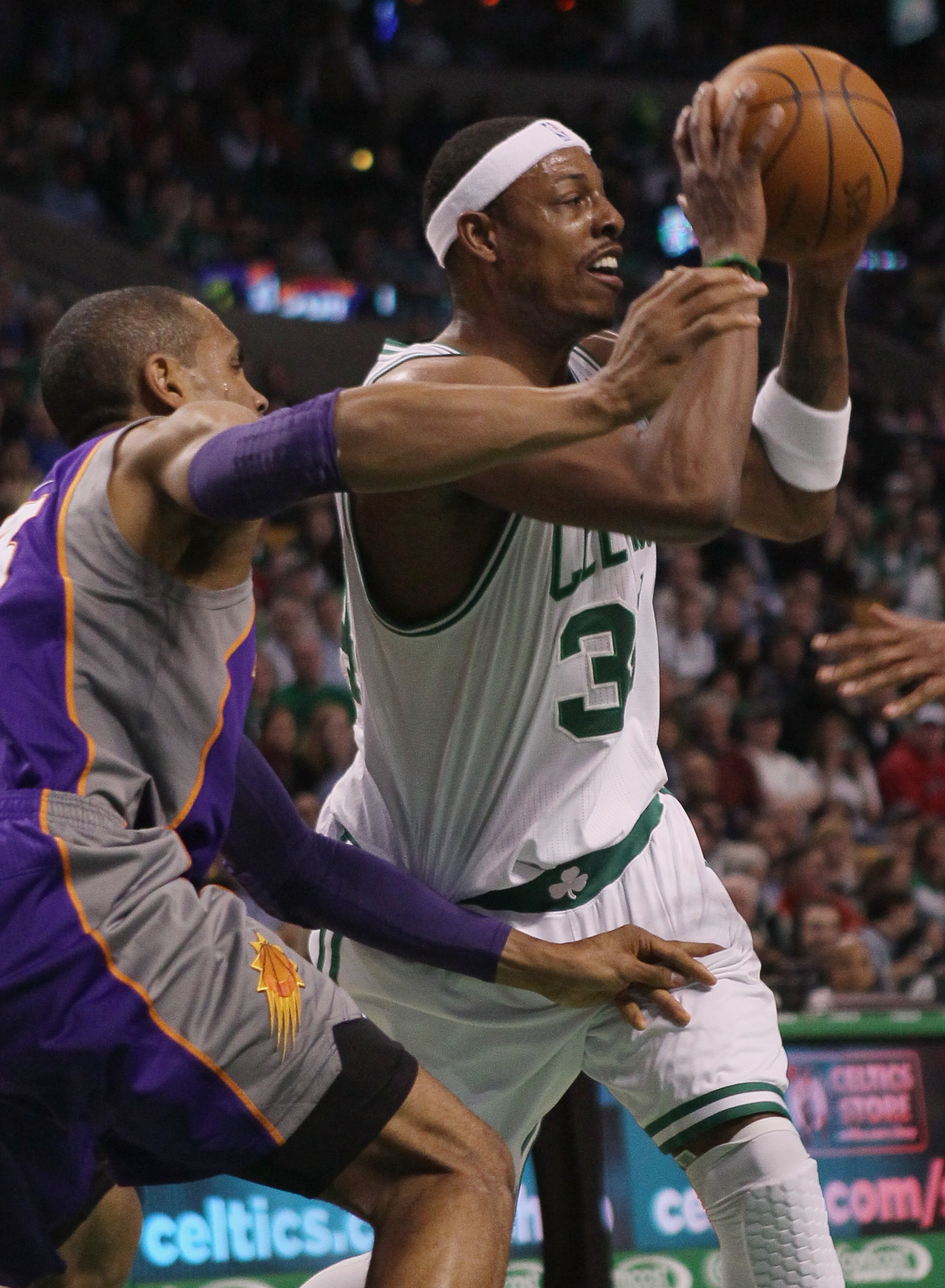 BOSTON, MA - MARCH 02:  Paul Pierce #34 of the Boston Celtics tries to pass the ball as Grant Hill #33 of the Phoenix Suns defends on March 2, 2011 at the TD Garden in Boston, Massachusetts.  NOTE TO USER: User expressly acknowledges and agrees that, by d