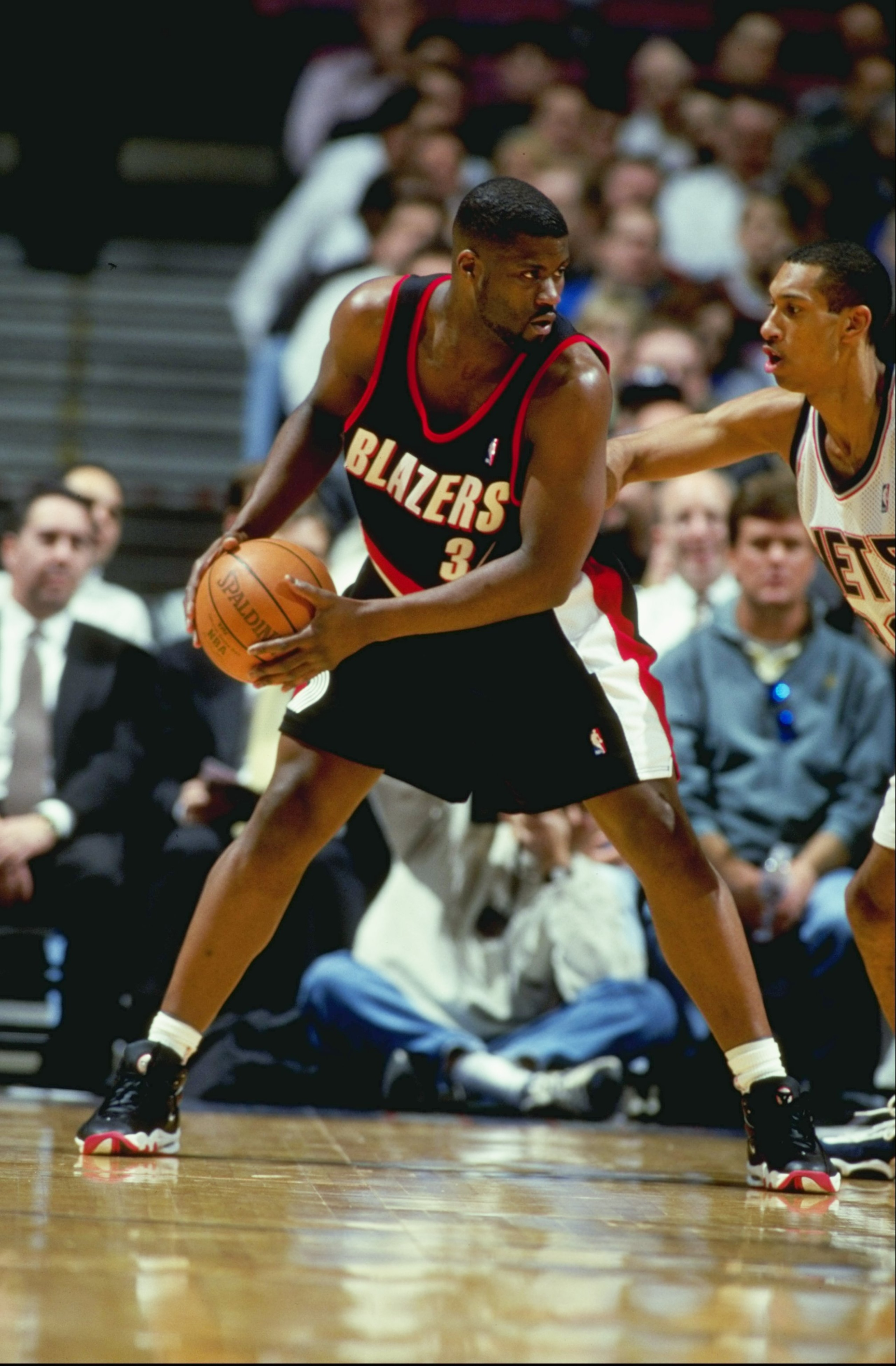 24 Feb 1999:  J.R. Rider #34 of the Portland Trailblazers looks to pass the ball during the game against the New Jersey Nets at the Continental Airlines Arena in East Rutherford, New Jersey. The Trailblazers defeated the Nets 94-85.  Mandatory Credit: Al