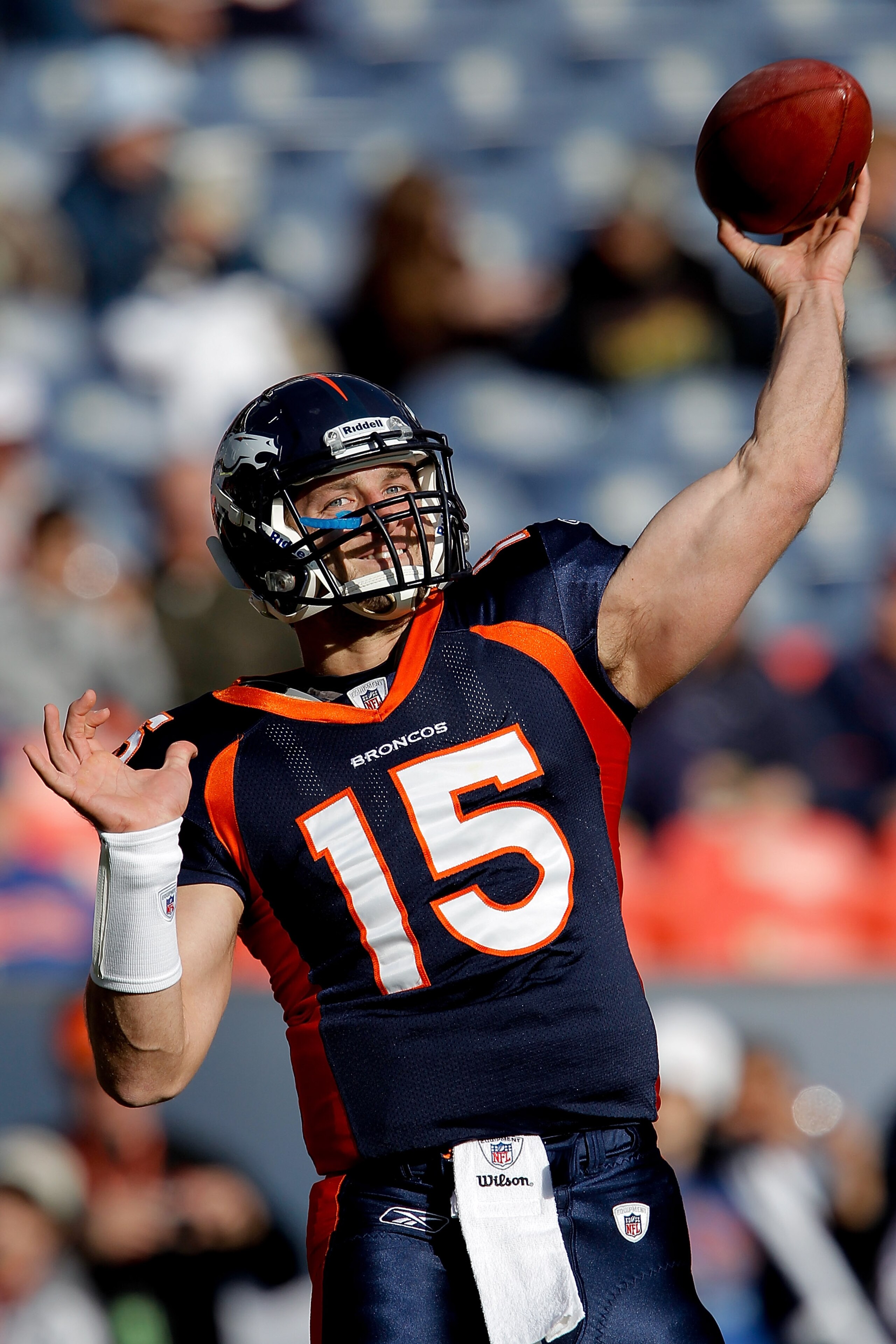 DENVER - DECEMBER 26:  Quarterback Tim Tebow #15 of the Denver Broncos warms up before taking on the Houston Texans at INVESCO Field at Mile High on December 26, 2010 in Denver, Colorado. (Photo by Justin Edmonds/Getty Images)