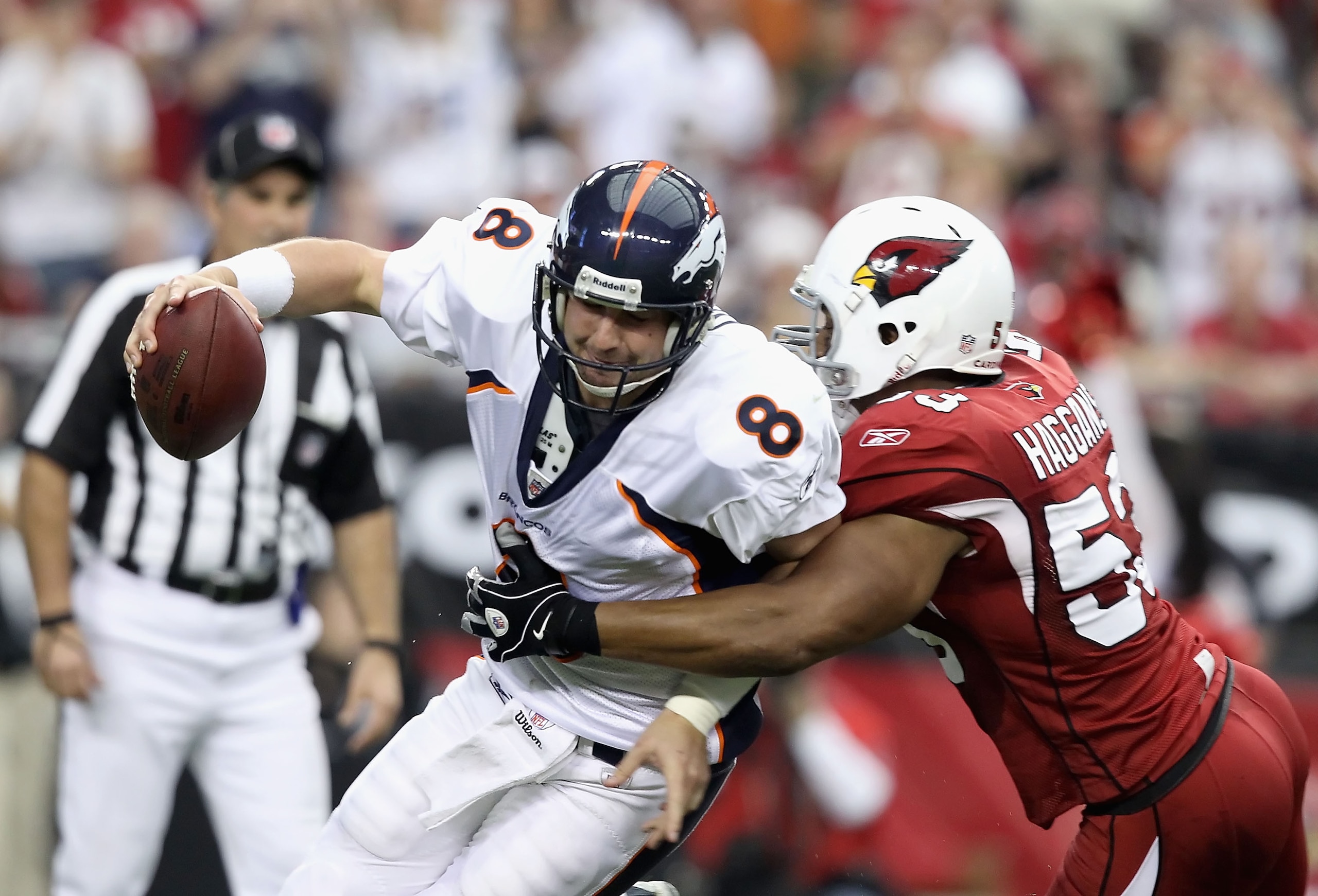 GLENDALE, AZ - DECEMBER 12:  Quarterback Kyle Orton #8 of the Denver Broncos is sacked by Clark Haggans #53 of the Arizona Cardinals during the NFL game at the University of Phoenix Stadium on December 12, 2010 in Glendale, Arizona.  The Cardinals defeate