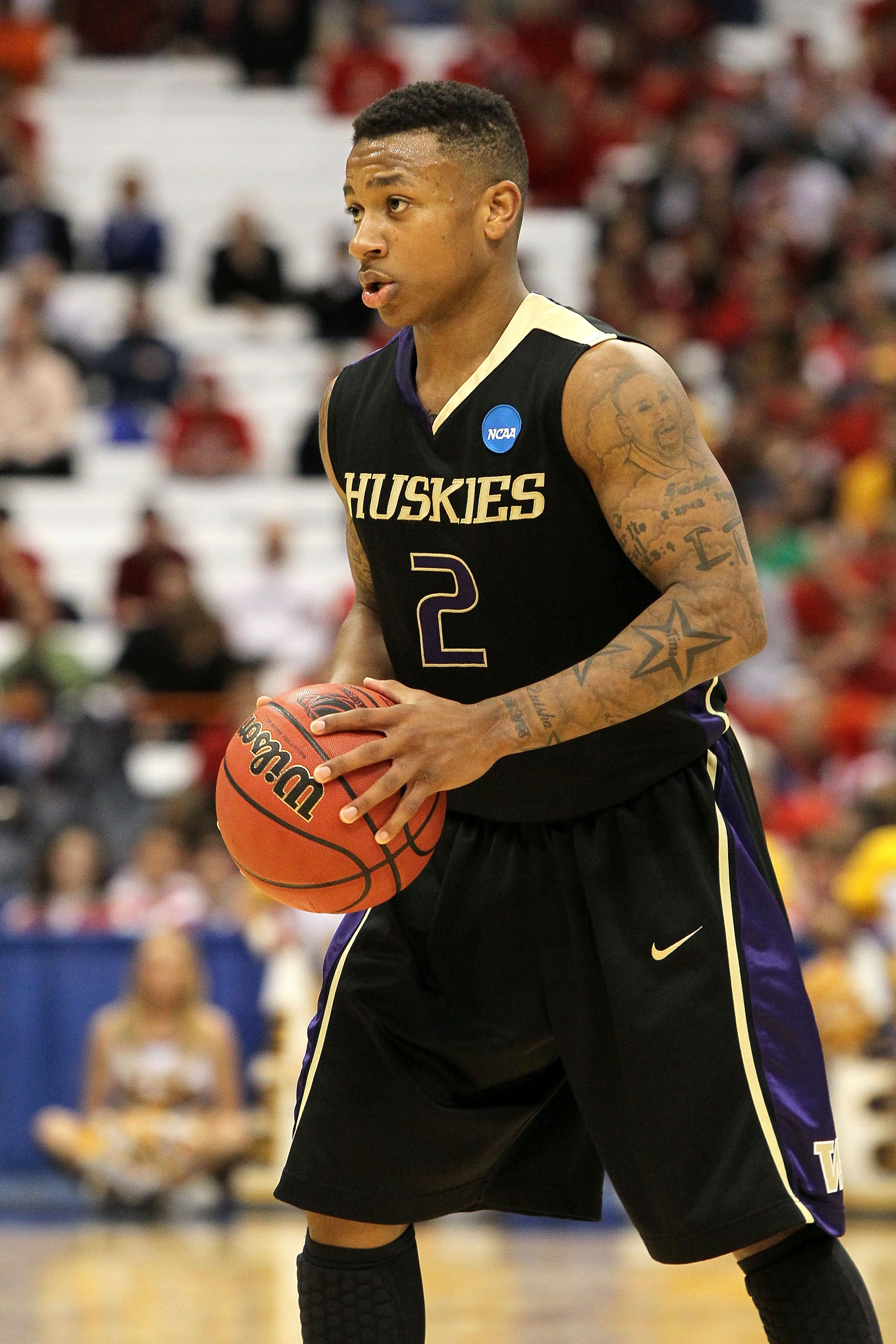 SYRACUSE, NY - MARCH 25:  Isiah Thomas #2 of the Washington Huskies looks to pass the ball against the West Virginia Mountaineers during the east regional semifinal of the 2010 NCAA men's basketball tournament at the Carrier Dome on March 25, 2010 in Syra