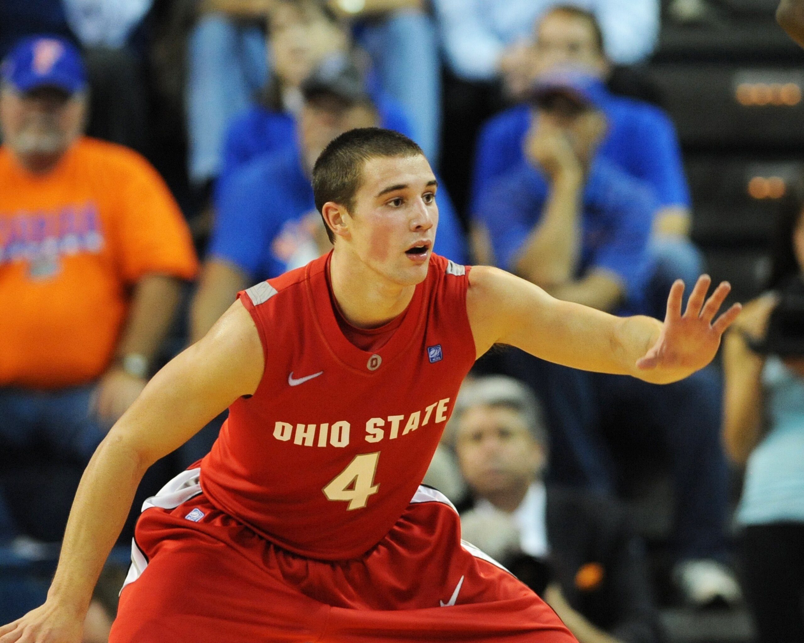 GAINESVILLE, FL - NOVEMBER 16: Guard Aaron Craft #4 of the Ohio State Buckeyes sets on defense against the Florida Gators November 16, 2010 at the Stephen C. O'Connell Center in Gainesville, Florida.  (Photo by Al Messerschmidt/Getty Images)