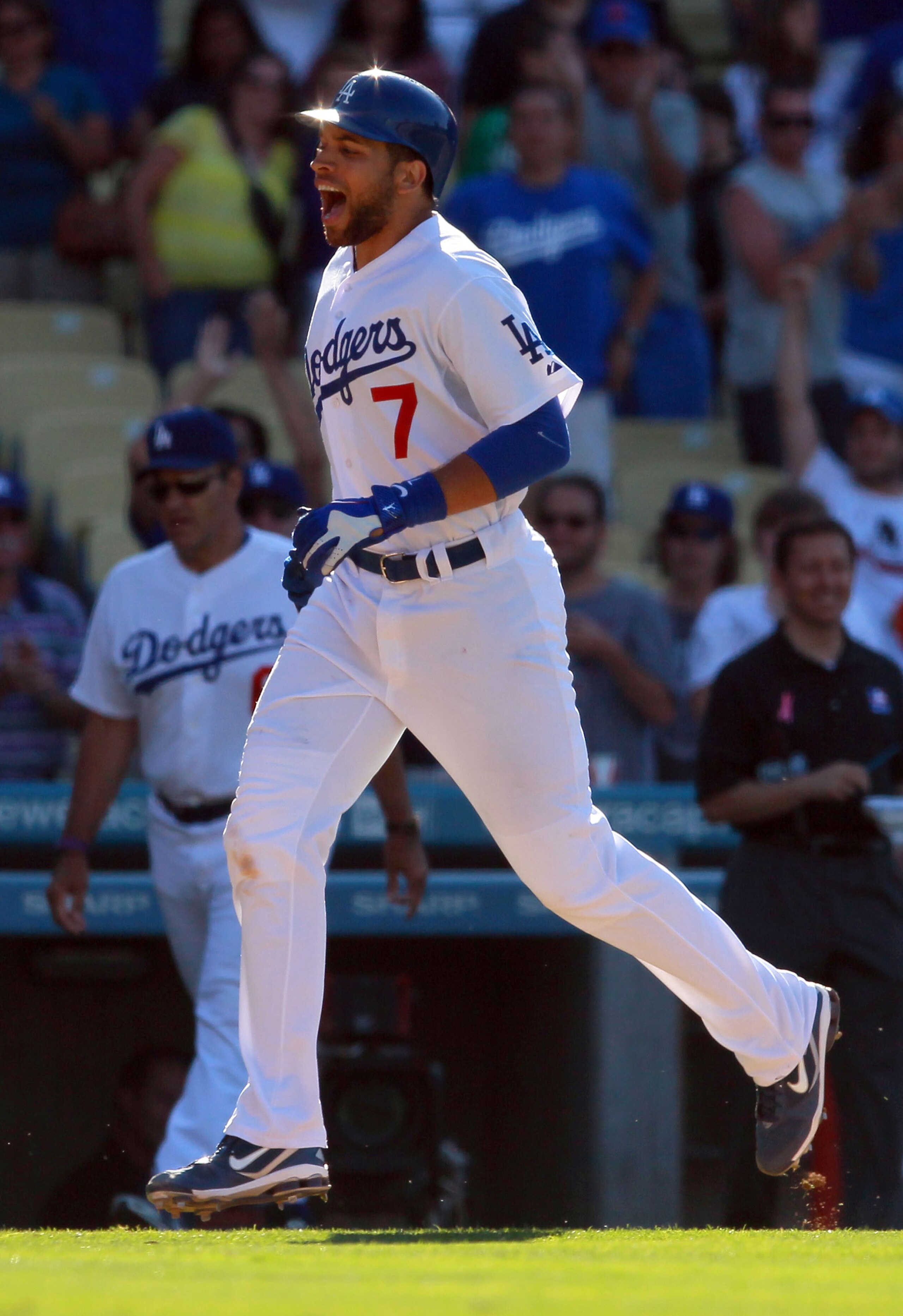 LOS ANGELES, CA - JULY 24:  James Loney #7 of the Los Angeles Dodgers celebrates as he rounds third base after hitting the game winning walk-off homerun in the 13th inning against the New York Mets at Dodger Stadium on July 24, 2010 in Los Angeles, Califo
