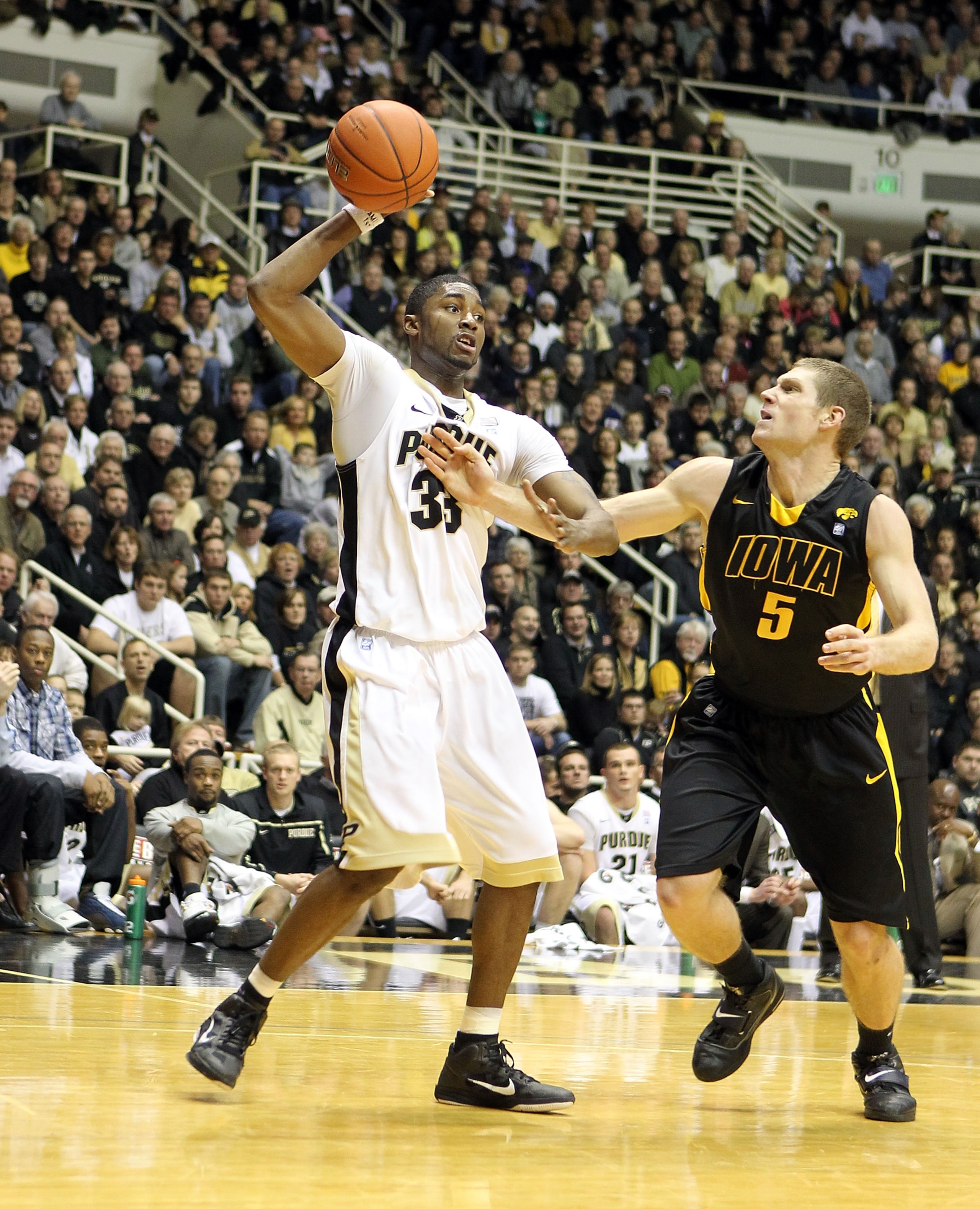 WEST LAFAYETTE, IN - JANUARY 09:  E'Twaun Moore #33 of the Purdue Boilermakers reaches for the ball against the Iowa Hawkeyes during the Big Ten Conference game at Mackey Arena on January 9, 2011 in West Lafayette, Indiana. Purdue won 75-52.  (Photo by An