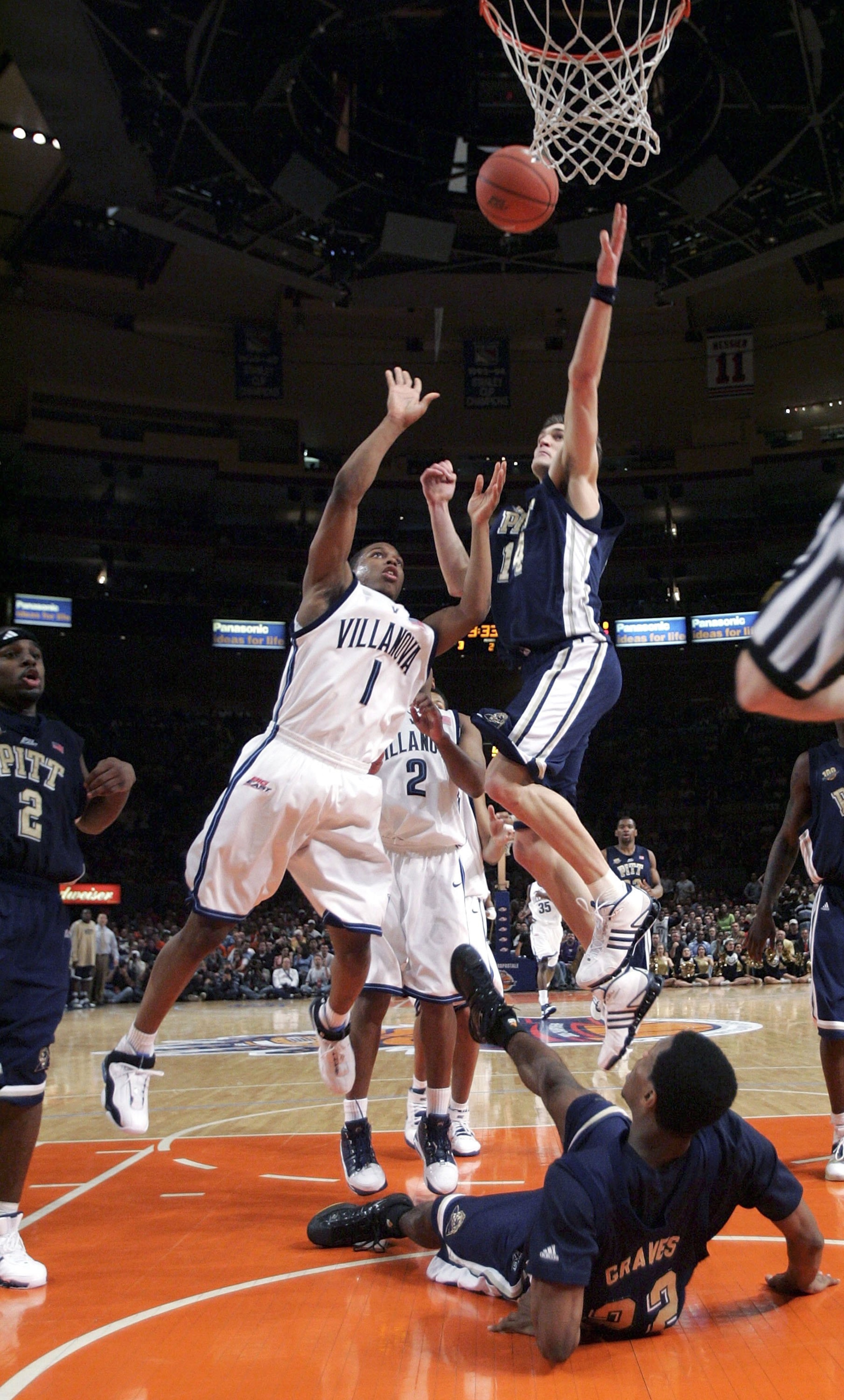 NEW YORK - MARCH 10:  Levon Kendall #14 of the Pittsburgh Panthers blocks a shot by Kyle Lowry #1 of the Villanova Wildcats as Antonio Graves #22 of Pittsburgh watches from the floor during the semifinals of the Big East Men's Basketball Championships at