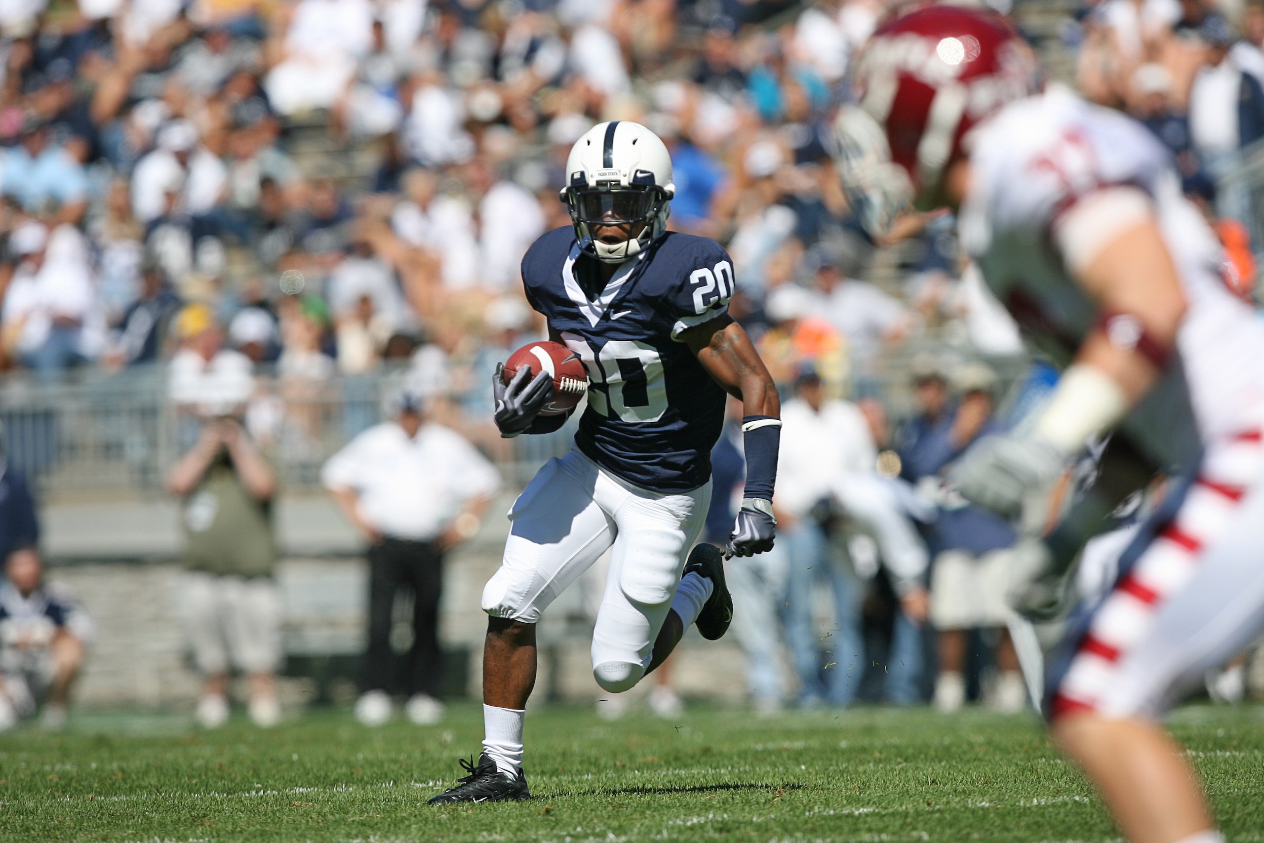 STATE COLLEGE, PA - SEPTEMBER 19: Wide receiver Devon Smith #20 of the Penn State Nittany Lions runs with the ball during a game against the Temple Owls on September 19, 2009 at Beaver Stadium in State College, Pennsylvania. (Photo by Hunter Martin/Getty