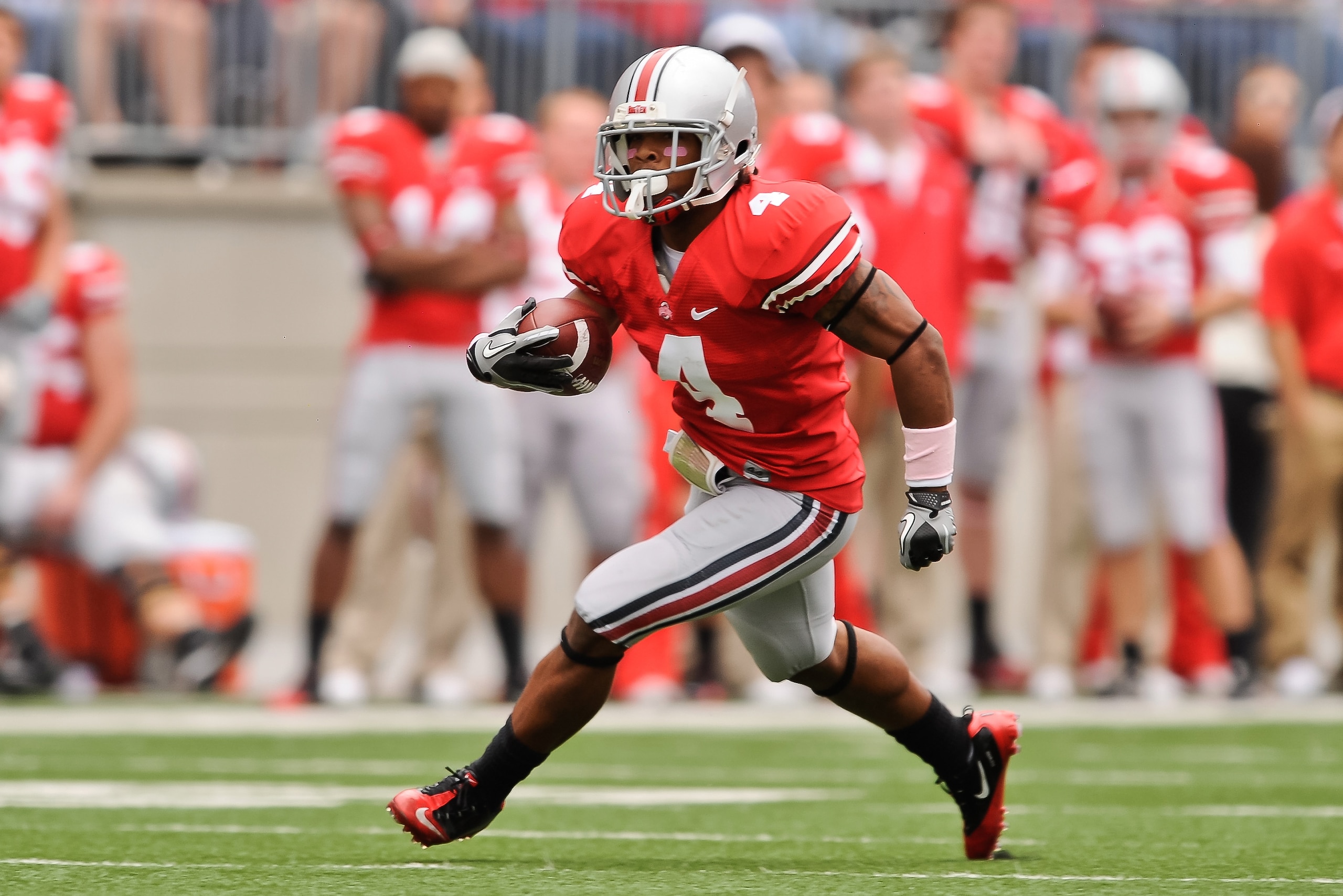 COLUMBUS, OH - OCTOBER 23:  Jaamal Berry #4 of the Ohio State Buckeyes runs with the ball against the Purdue Boilermakers at Ohio Stadium on October 23, 2010 in Columbus, Ohio.  (Photo by Jamie Sabau/Getty Images)