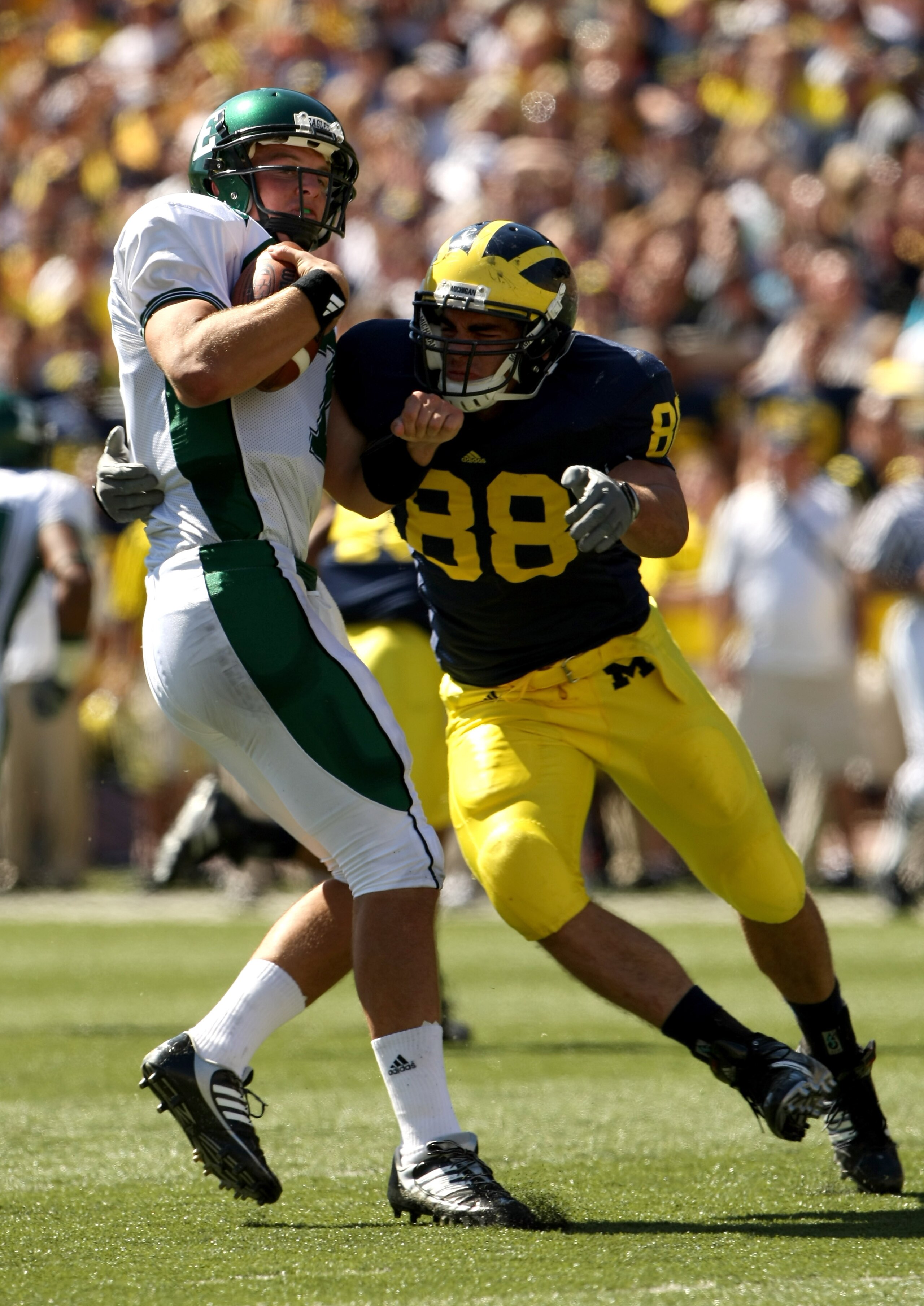 ANN ARBOR, MI - SEPTEMBER 19: Linebacker Craig Roh #88 of the Michigan Wolverines sacks quarterback Andy Schmitt #7 of the Eastern Michigan Eagles at Michigan Stadium on September 19, 2009 in Ann Arbor, Michigan.  Michigan won 45-17.  (Photo by Stephen Du