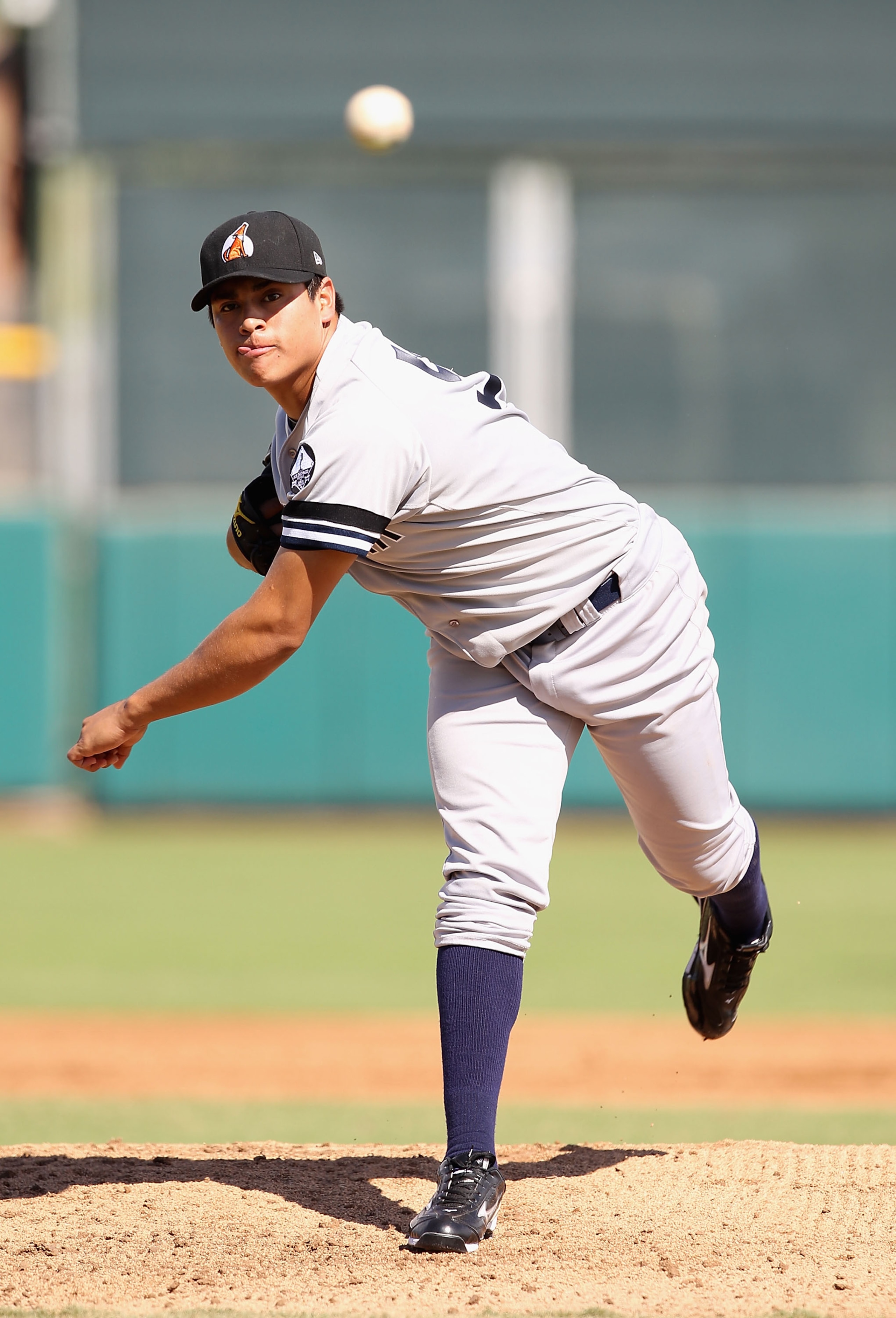 SCOTTSDALE, AZ - OCTOBER 23:  New York Yankees prospect Manuel Banuelos playing for the Phoenix Desert Dogs pitches against the Scottsdale Scorpions during the AZ Fall League game at Scottsdale Stadium on October 23, 2010 in Scottsdale, Arizona.  (Photo b