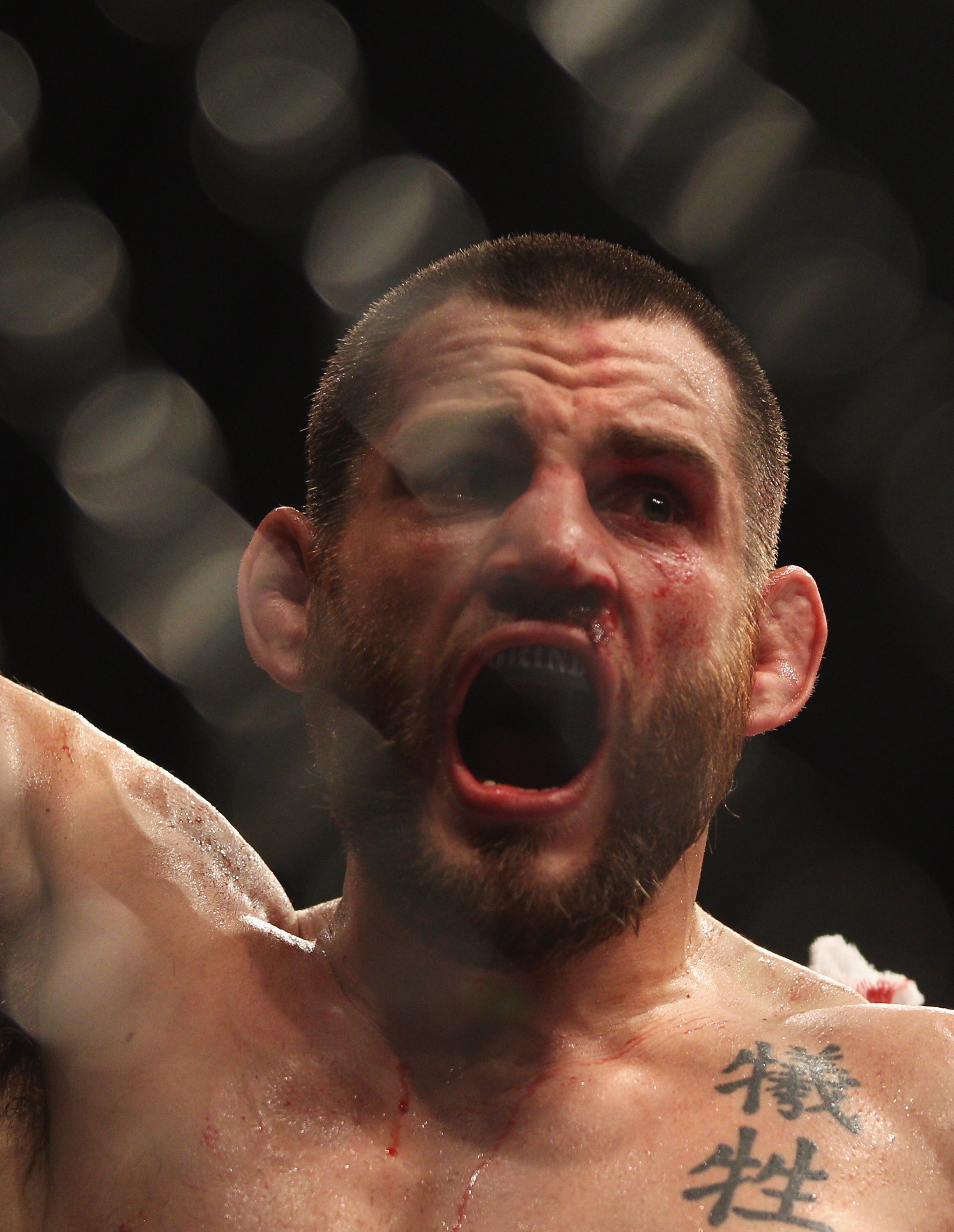 SYDNEY, AUSTRALIA - FEBRUARY 27:  Jon Fitch of the USA celebrates after his drawn fight against BJ Penn of the USA during their welterweight bout part of  UFC 127 at Acer Arena on February 27, 2011 in Sydney, Australia.  (Photo by Mark Kolbe/Getty Images)