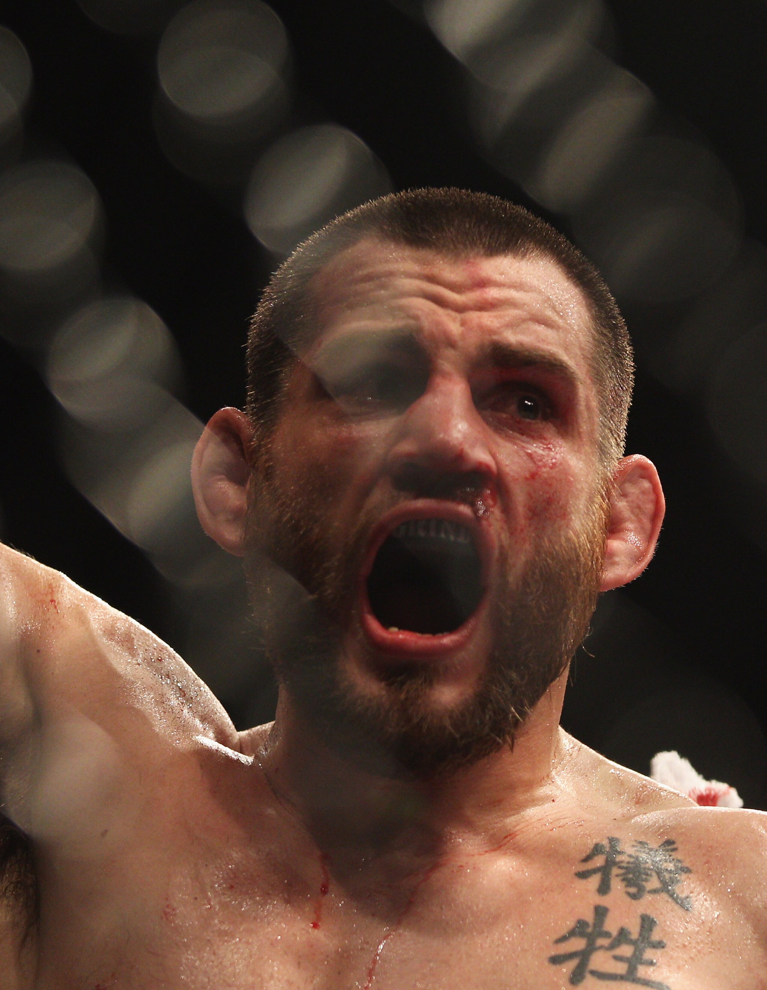 SYDNEY, AUSTRALIA - FEBRUARY 27:  Jon Fitch of the USA celebrates after his drawn fight against BJ Penn of the USA during their welterweight bout part of  UFC 127 at Acer Arena on February 27, 2011 in Sydney, Australia.  (Photo by Mark Kolbe/Getty Images)