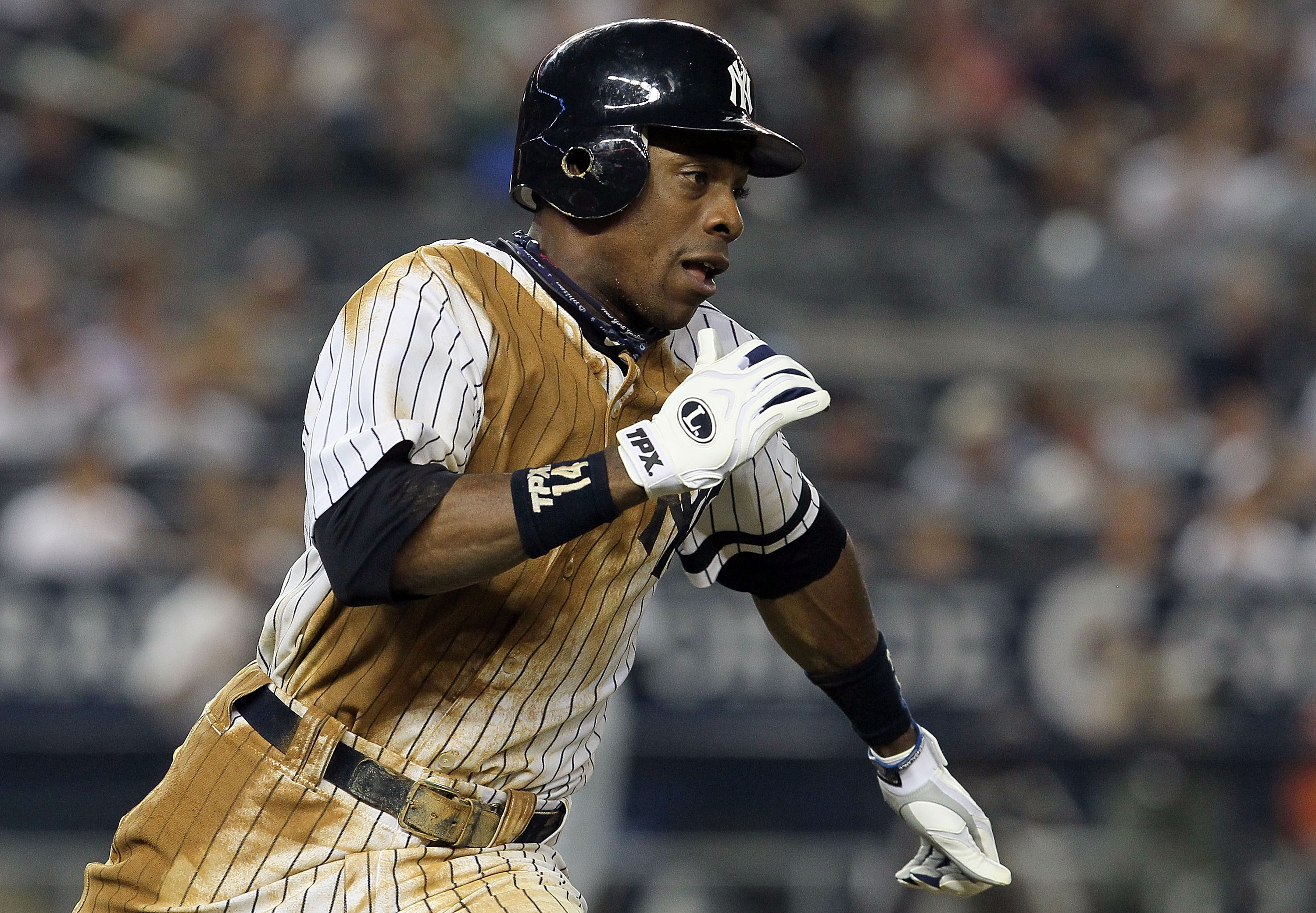NEW YORK - AUGUST 16:  Curtis Granderson #14 of the New York Yankees runs out a seventh inning double against the Detroit Tigers on August 16, 2010 at Yankee Stadium in the Bronx borough of New York City.  (Photo by Jim McIsaac/Getty Images)