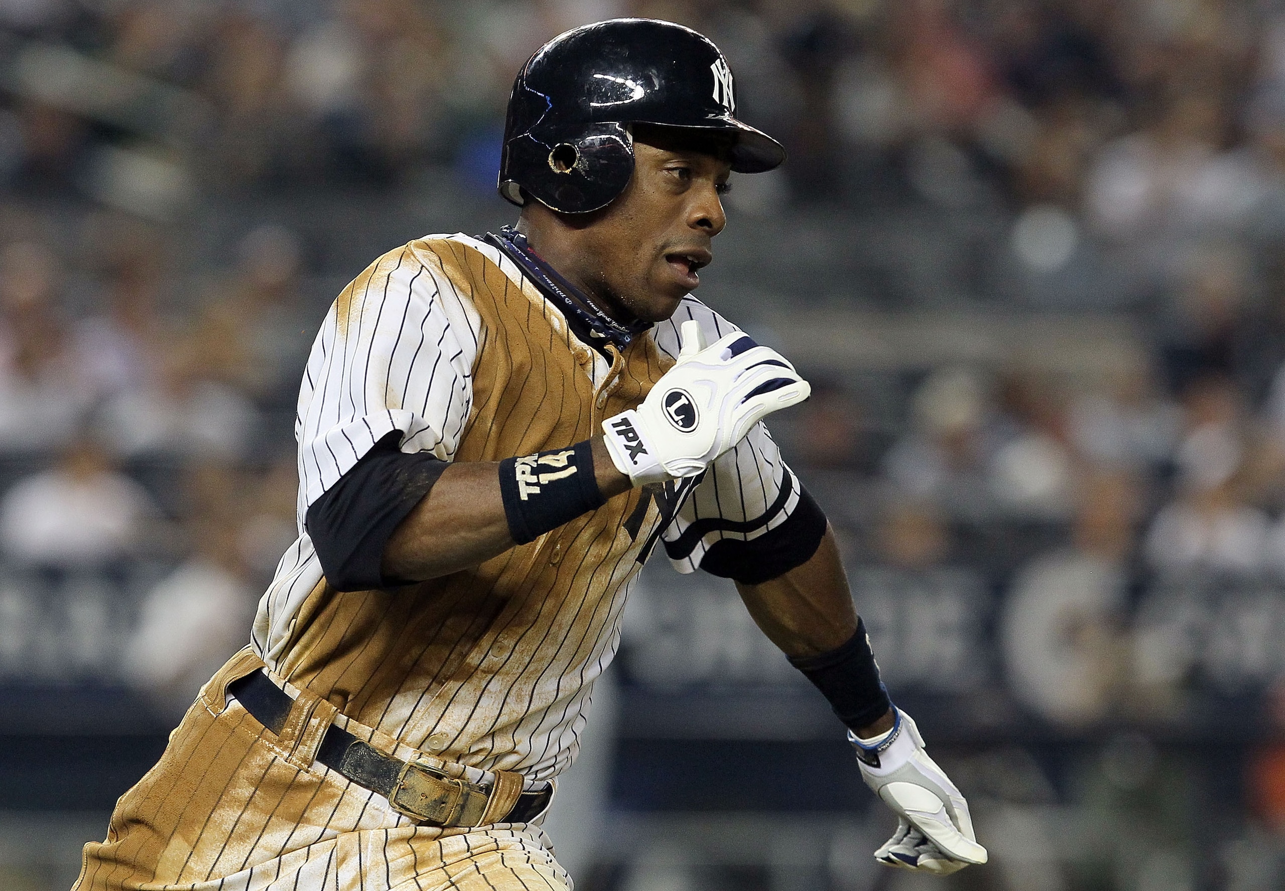 NEW YORK - AUGUST 16:  Curtis Granderson #14 of the New York Yankees runs out a seventh inning double against the Detroit Tigers on August 16, 2010 at Yankee Stadium in the Bronx borough of New York City.  (Photo by Jim McIsaac/Getty Images)