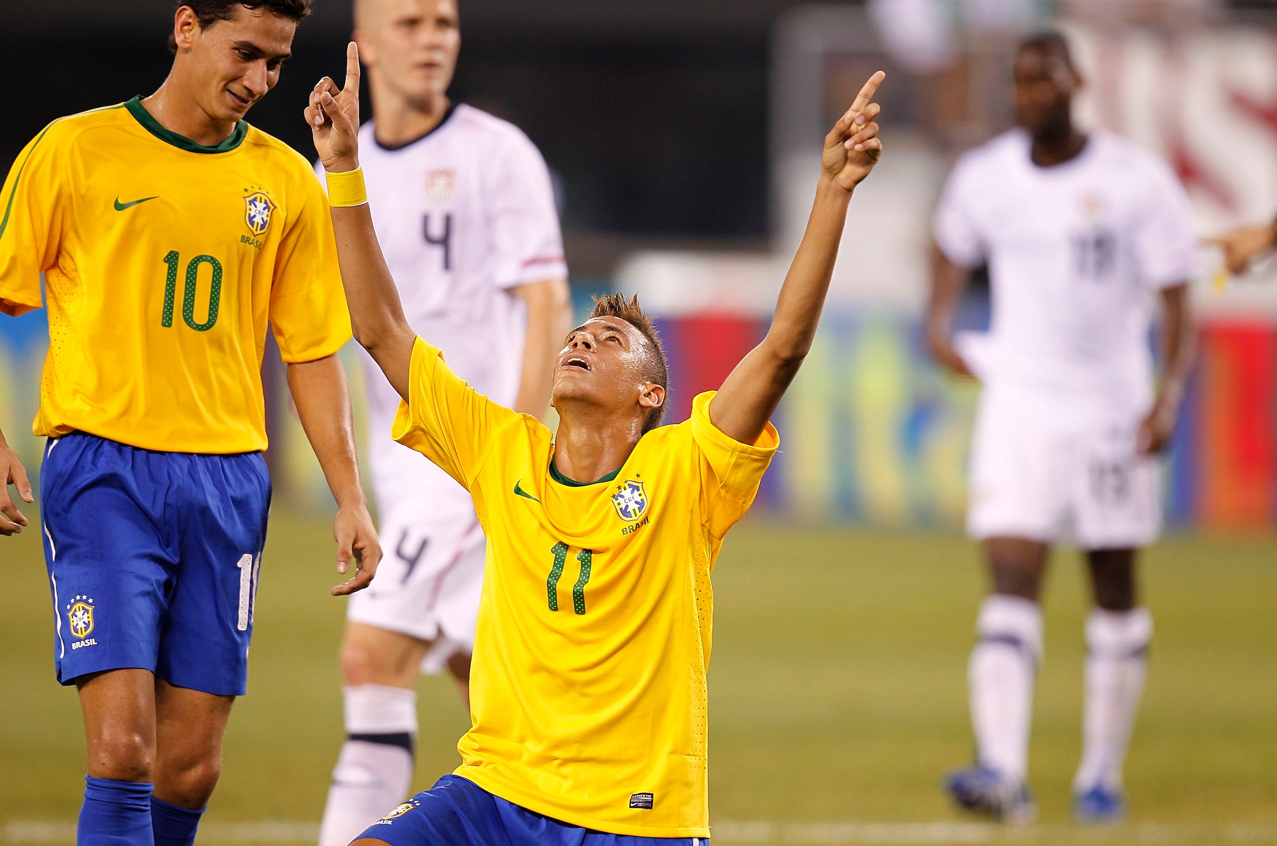 EAST RUTHERFORD, NJ - AUGUST 10: Neymar #11 and Paulo Henrique Ganso #10 of Brazil celebrate Neymar's goal against the U.S. in the first half of a friendly match at the New Meadowlands on August 10, 2010 in East Rutherford, New Jersey. (Photo by Jeff Ze EAST RUTHERFORD, NJ - AUGUST 10: Neymar #11 and Paulo Henrique Ganso #10 of Brazil celebrate Neymar's goal against the U.S. in the first half of a friendly match at the New Meadowlands on August 10, 2010 in East Rutherford, New Jersey. (Photo by Jeff Ze