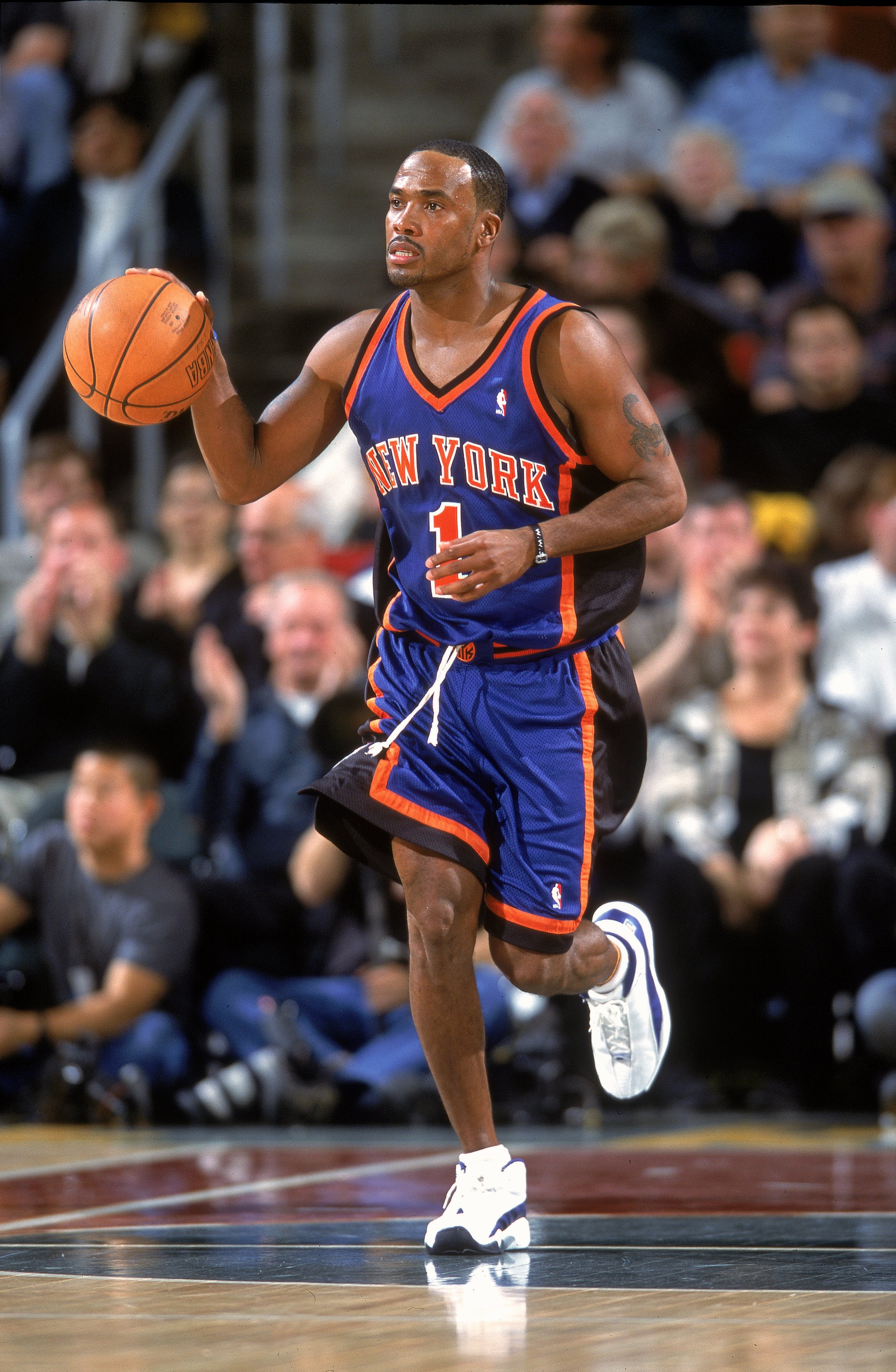 14 Nov 2000:  Chris Childs #1 of the New York Knicks moves the ball during the game against the Seattle SuperSonics at Key Arena in Seattle, Washington.  The SuperSonics defeated the Knicks 96-75.   NOTE TO USER: It is expressly understood that the only r