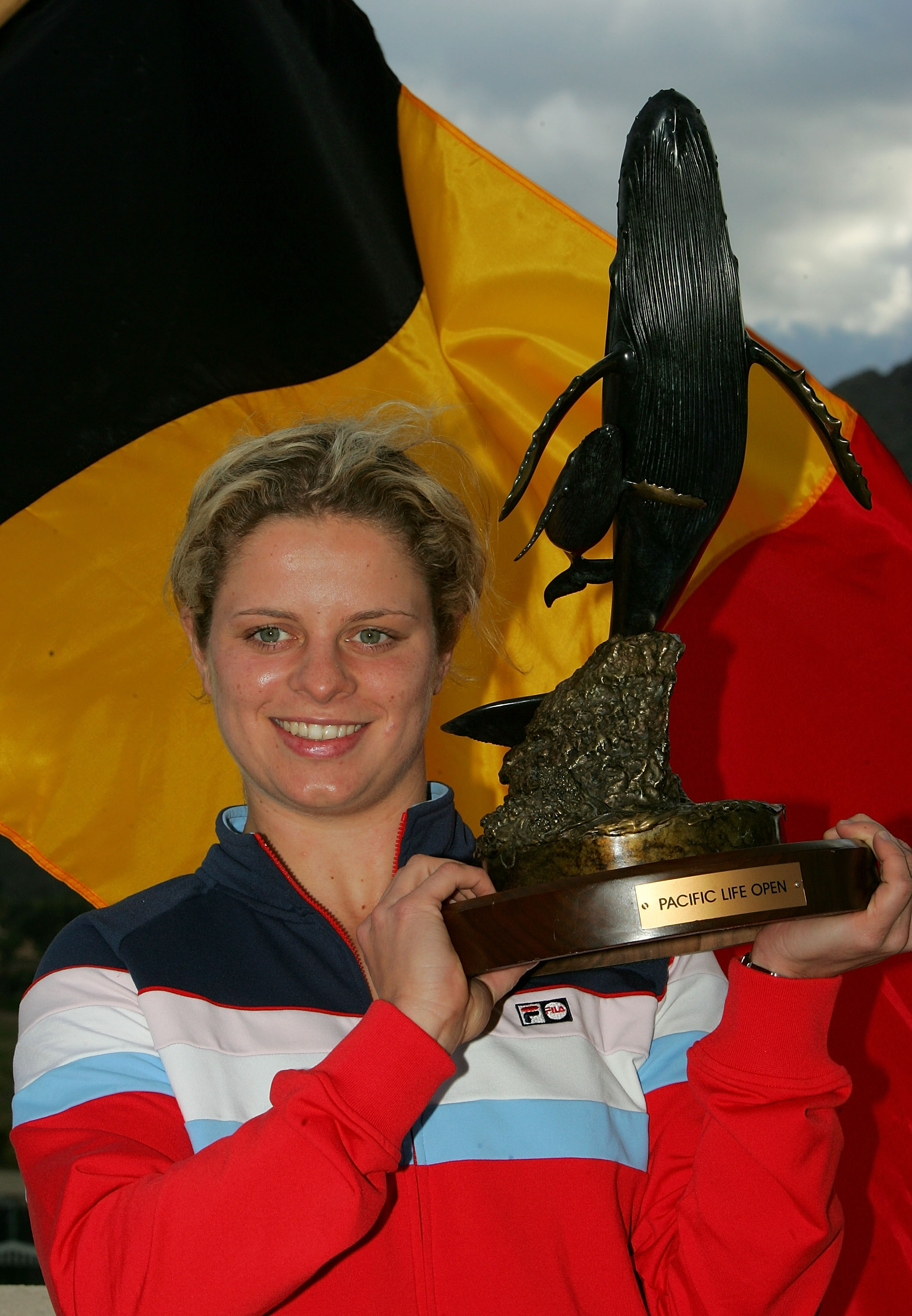 INDIAN WELLS, CA - MARCH 19:  Kim Clijsters of Belgium poses with the trophy after defeating Lindsay Davenport in the championship final of the Pacific Life Open at the Indian Wells Tennis Garden on March 19, 2005 in Indian Wells, California.  Clijstes wo