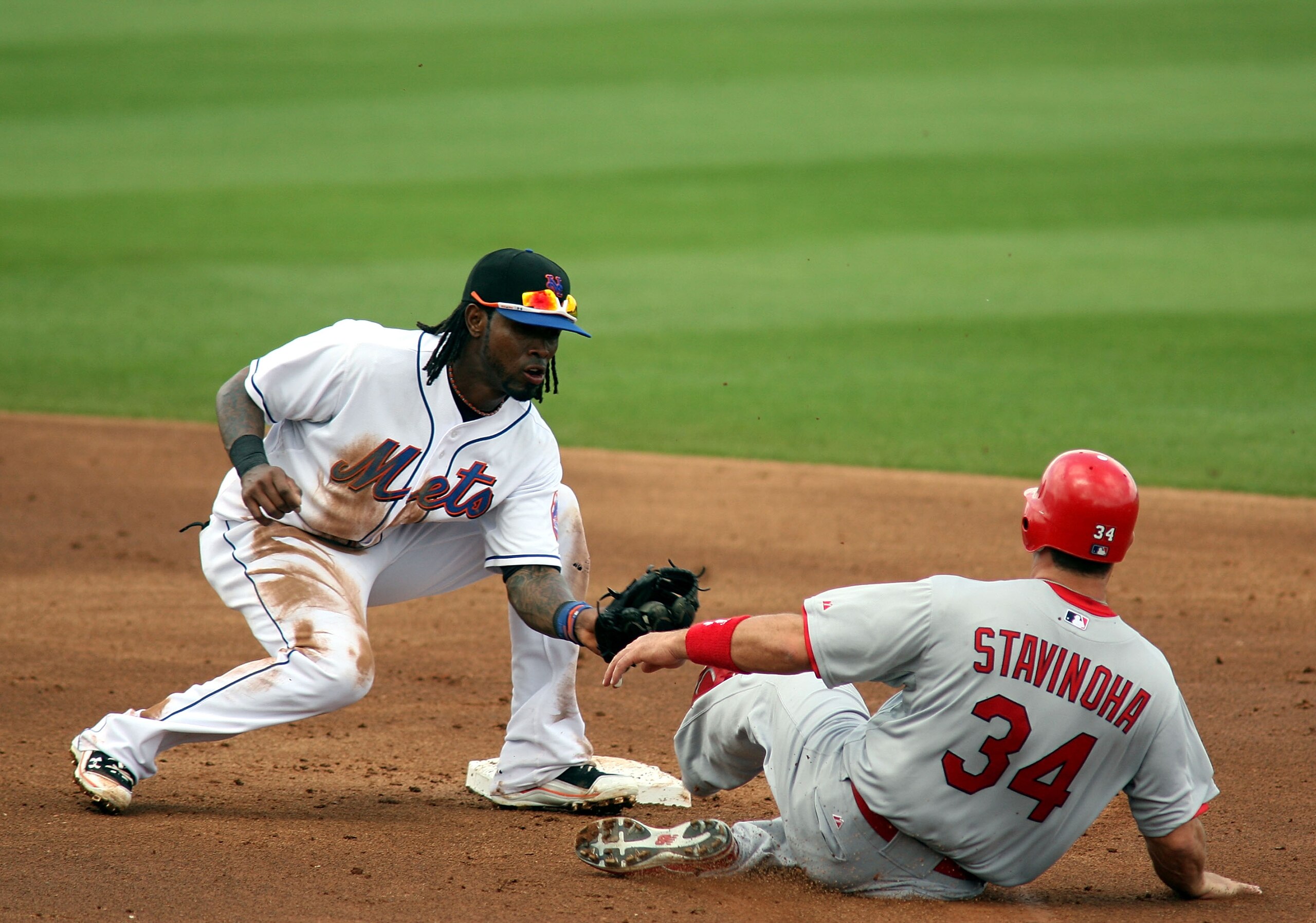 PORT ST. LUCIE, FL - MARCH 03:  Shortstop Jose Reyes #7 of the New York Mets catches Nick Stavinoha #34  of the St. Louis Cardinals stealing second base at Digital Domain Park on March 3, 2011 in Port St. Lucie, Florida.  (Photo by Marc Serota/Getty Image