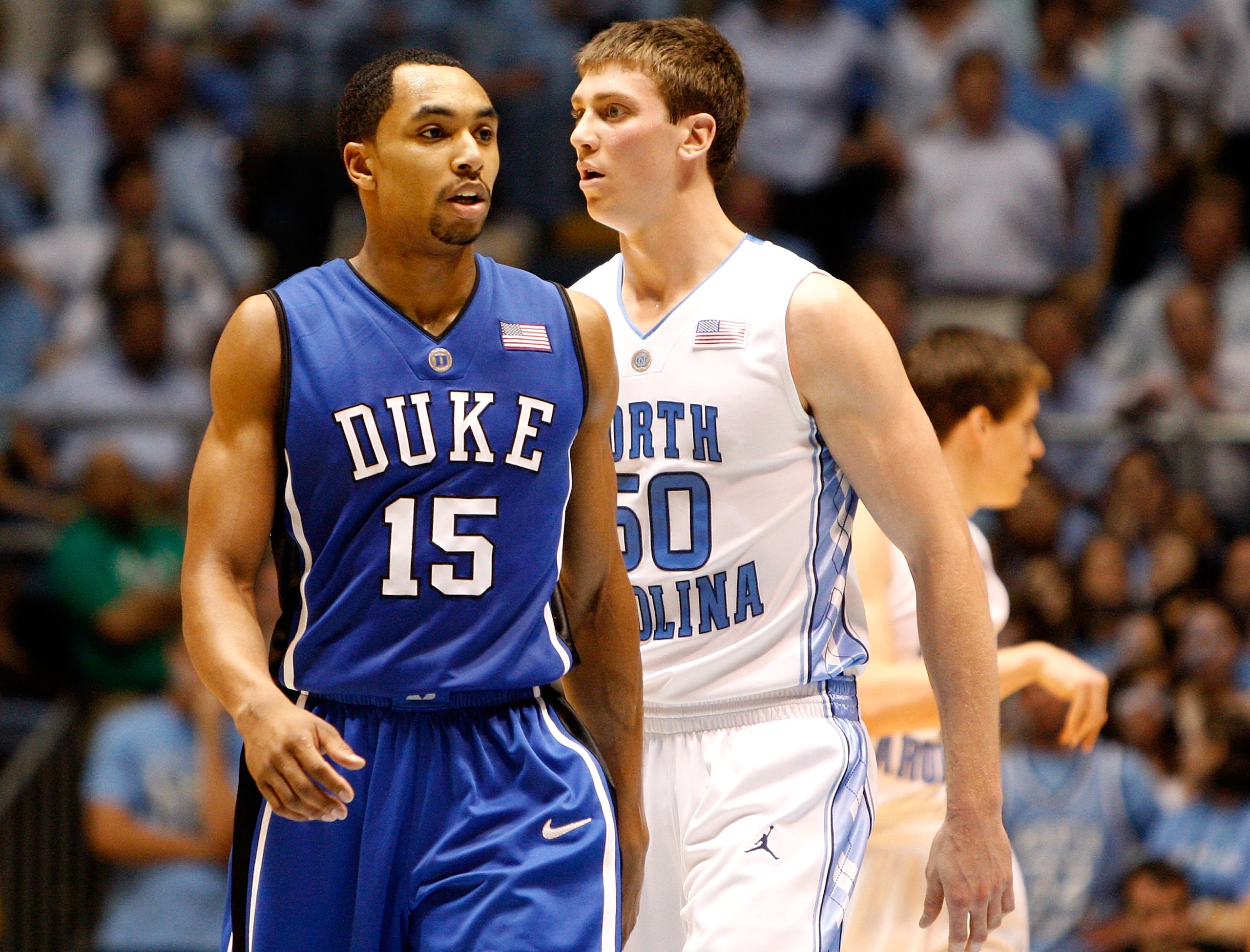 CHAPEL HILL, NC - MARCH 08:  Gerald Henderson #15 of the Duke Blue Devils walks by Tyler Hansbrough #50 of the North Carolina Tar Heels during their game at the Dean E. Smith Center on March 8, 2009 in Chapel Hill, North Carolina.  (Photo by Streeter Leck