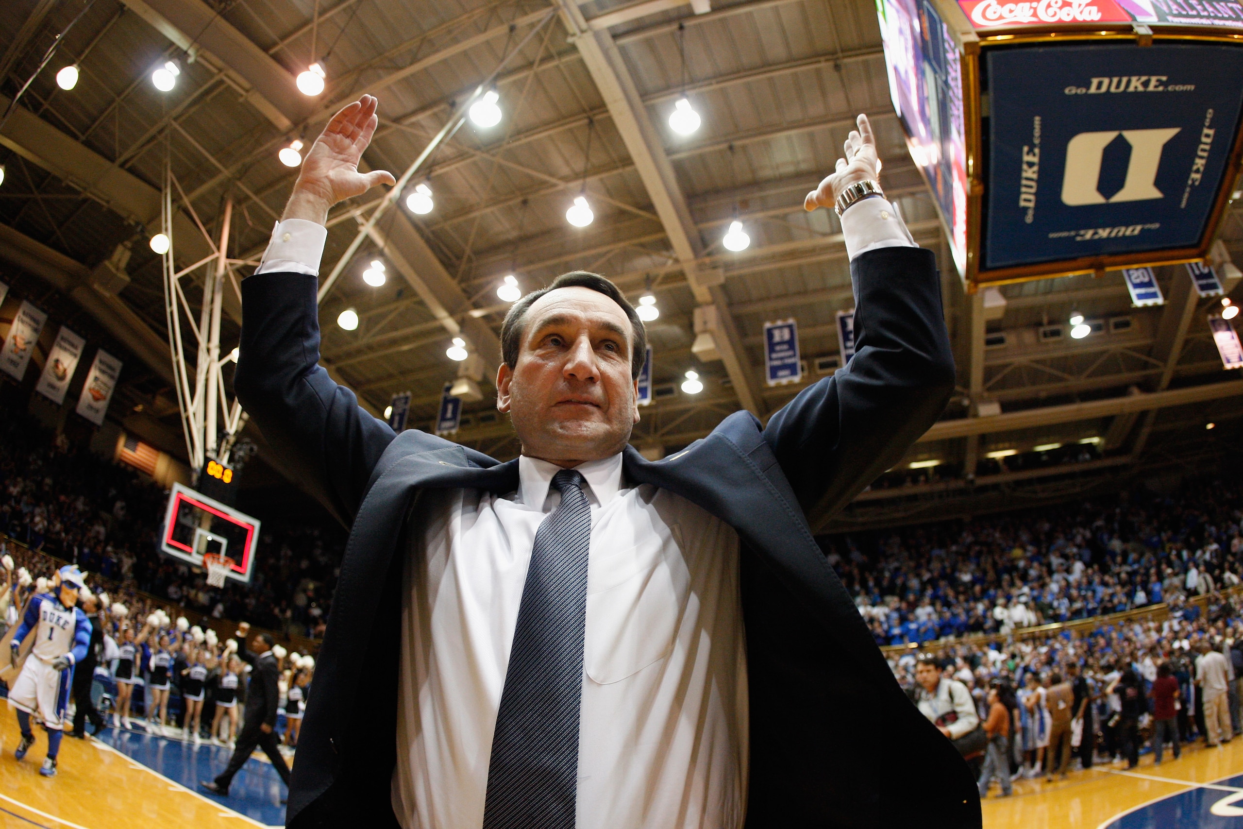 DURHAM, NC - FEBRUARY 09:  Head coach Mike Krzyzewski of the Duke Blue Devils celebrates with fans after defeating the North Carolina Tar Heels 79-73 at Cameron Indoor Stadium on February 9, 2011 in Durham, North Carolina.  (Photo by Streeter Lecka/Getty