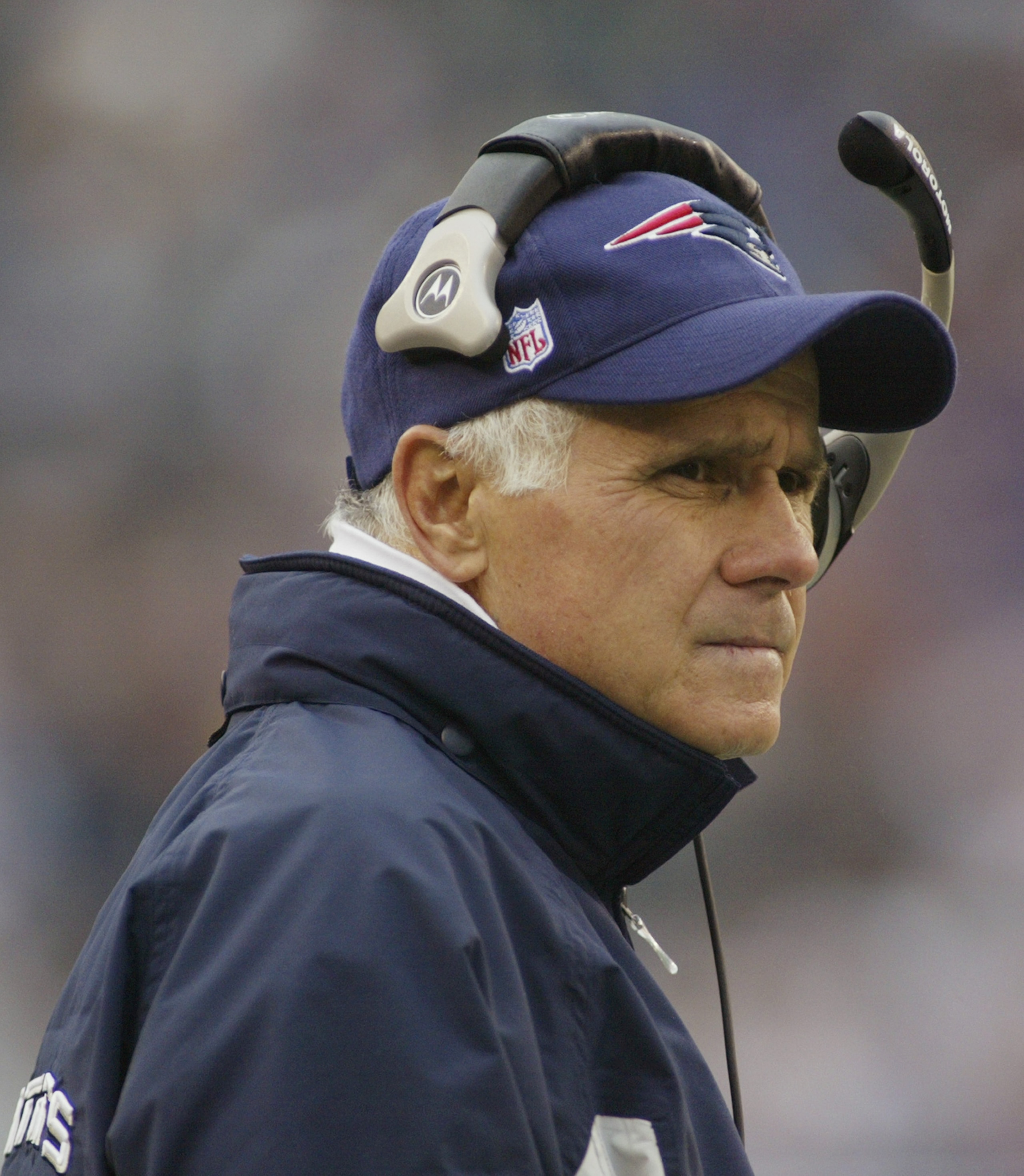 FOXBOROUGH, MA - OCTOBER 24: Offensive Line and Assistant Head Coach Dante Scarnecchia of the New England Patriots looks on from the sideline during the game against the New York Jets on October 24, 2004 at Gillette Stadium in Foxboro, Massachusetts. The FOXBOROUGH, MA - OCTOBER 24: Offensive Line and Assistant Head Coach Dante Scarnecchia of the New England Patriots looks on from the sideline during the game against the New York Jets on October 24, 2004 at Gillette Stadium in Foxboro, Massachusetts. The