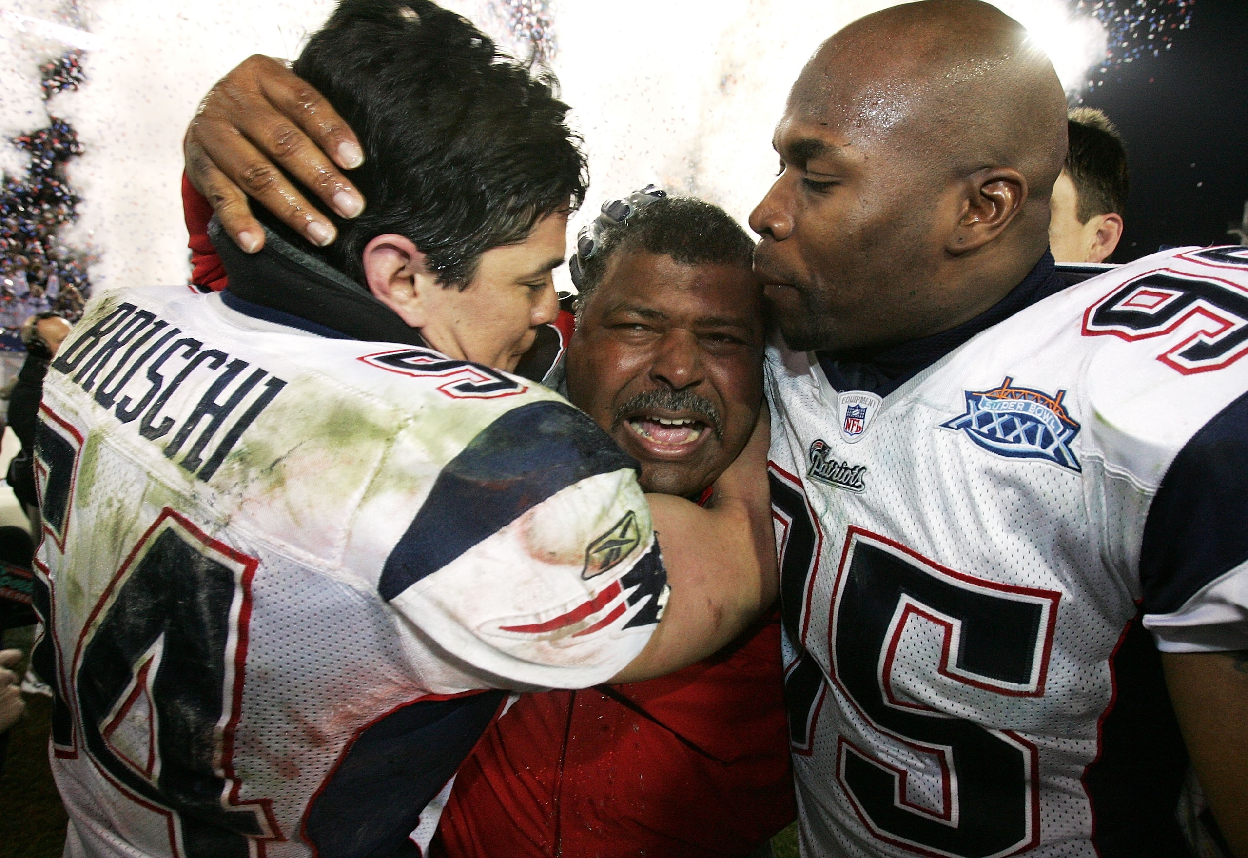 JACKSONVILLE, FLORIDA - FEBRUARY 06: Linebackers Tedy Bruschi #54 and Roman Phifer #95 of the New England Patriots congratulate defensive coordinator Romeo Crennel after defeating the Philadelphia Eagles during Super Bowl XXXIX at Alltel Stadium on Febru JACKSONVILLE, FLORIDA - FEBRUARY 06: Linebackers Tedy Bruschi #54 and Roman Phifer #95 of the New England Patriots congratulate defensive coordinator Romeo Crennel after defeating the Philadelphia Eagles during Super Bowl XXXIX at Alltel Stadium on Febru